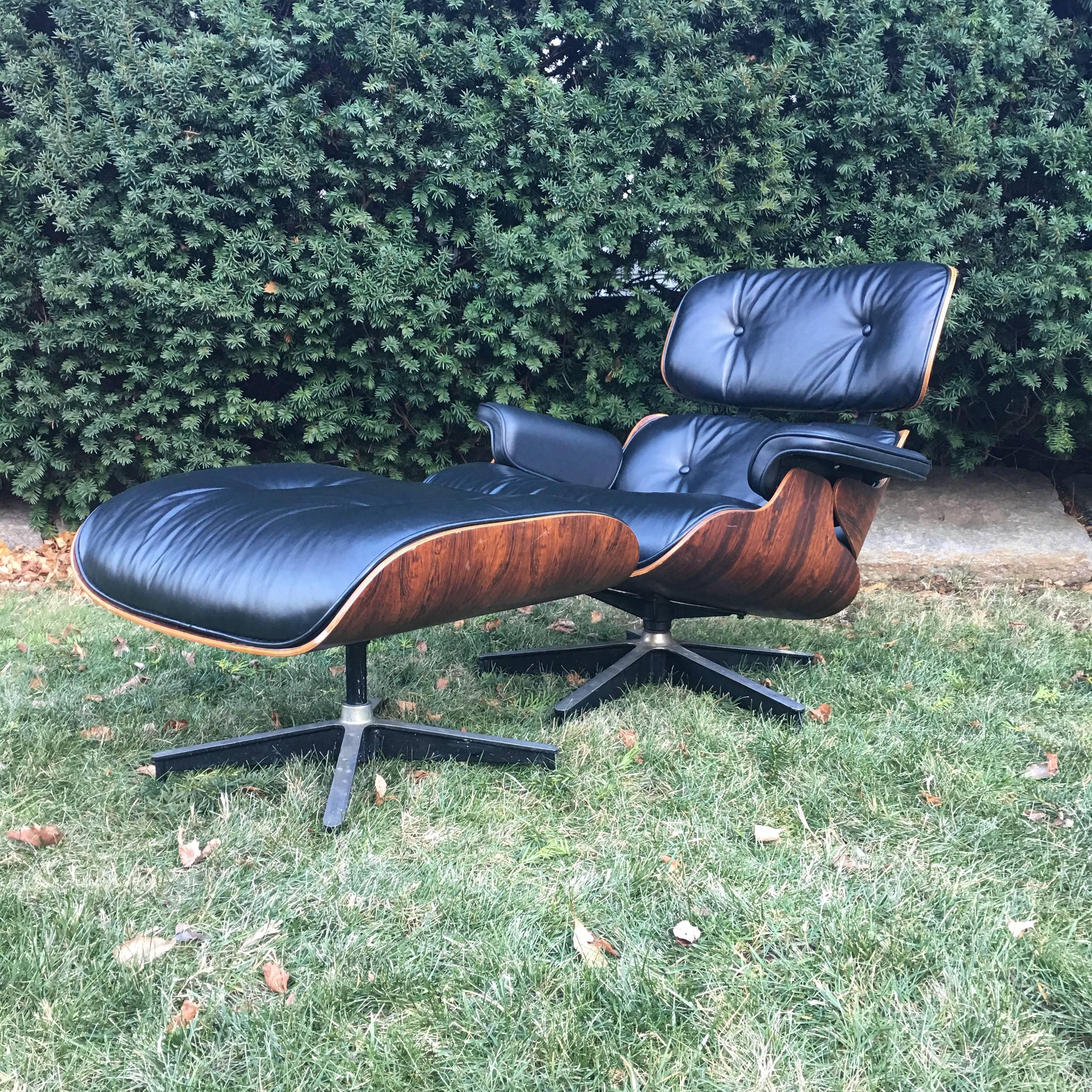Superb edition of the Classic Eames lounge chair and ottoman. New leather upholstery. Super grain and banding in the rosewood. Gorgeous color. Shock mounts are nice and tight. The epoxy was professionally redone. Simply a stunning set.