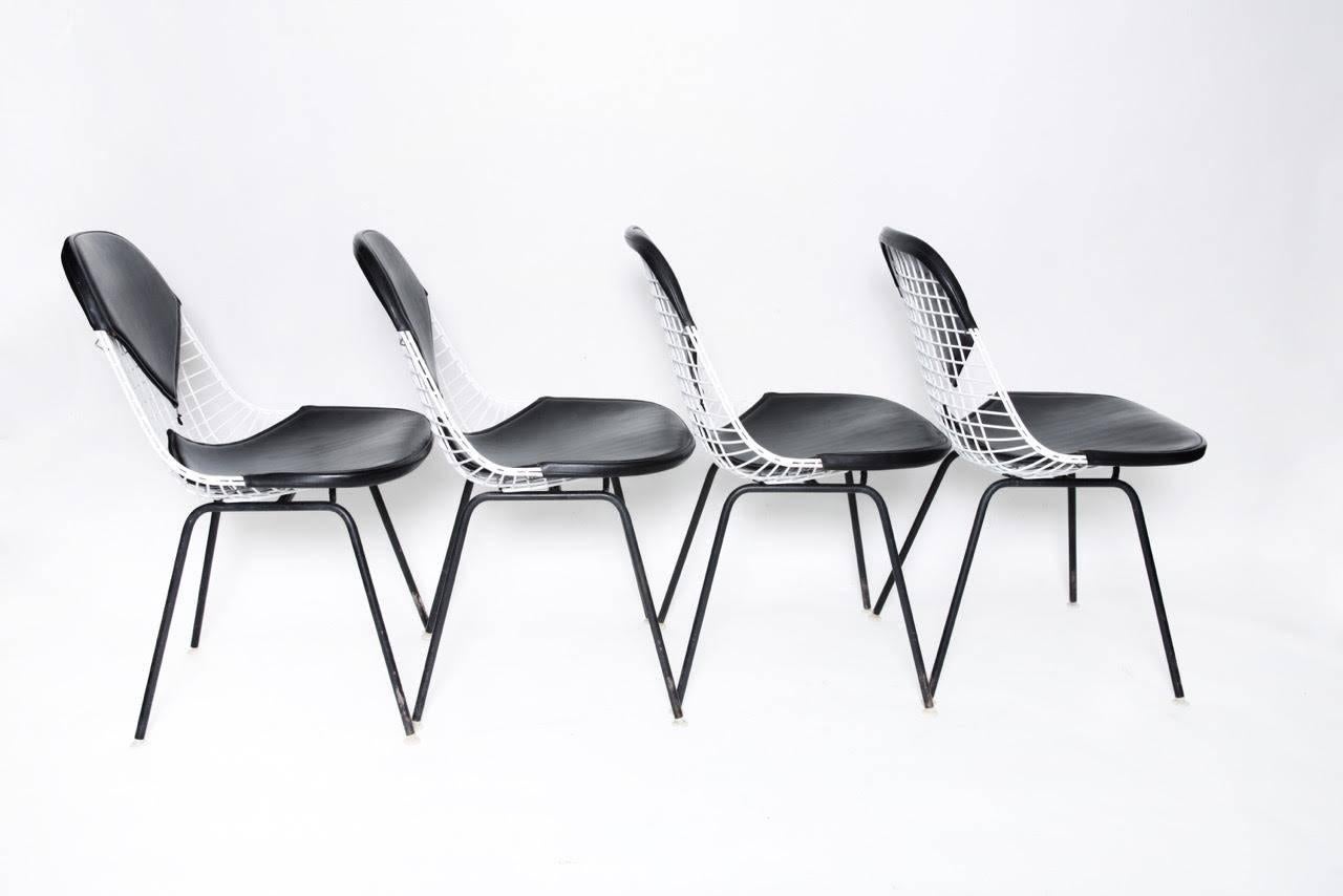 Four Herman Miller Eames DKX-2 bikini chairs. In excellent original condition with normal wear. All pads original. All glides and screws present. Also available with matching original 42" round Eames dining table.