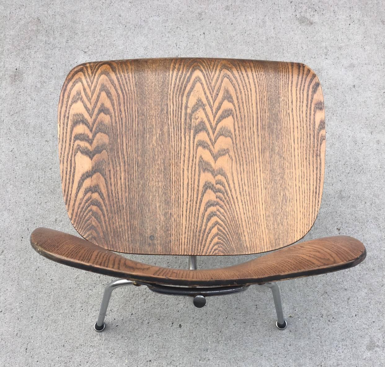 Early 1950s Herman Miller Eames Ash DCM dining chair. Some of the most spectacular grains and patina we have ever seen in this finish. Original mounts have been reapplied. New glides.