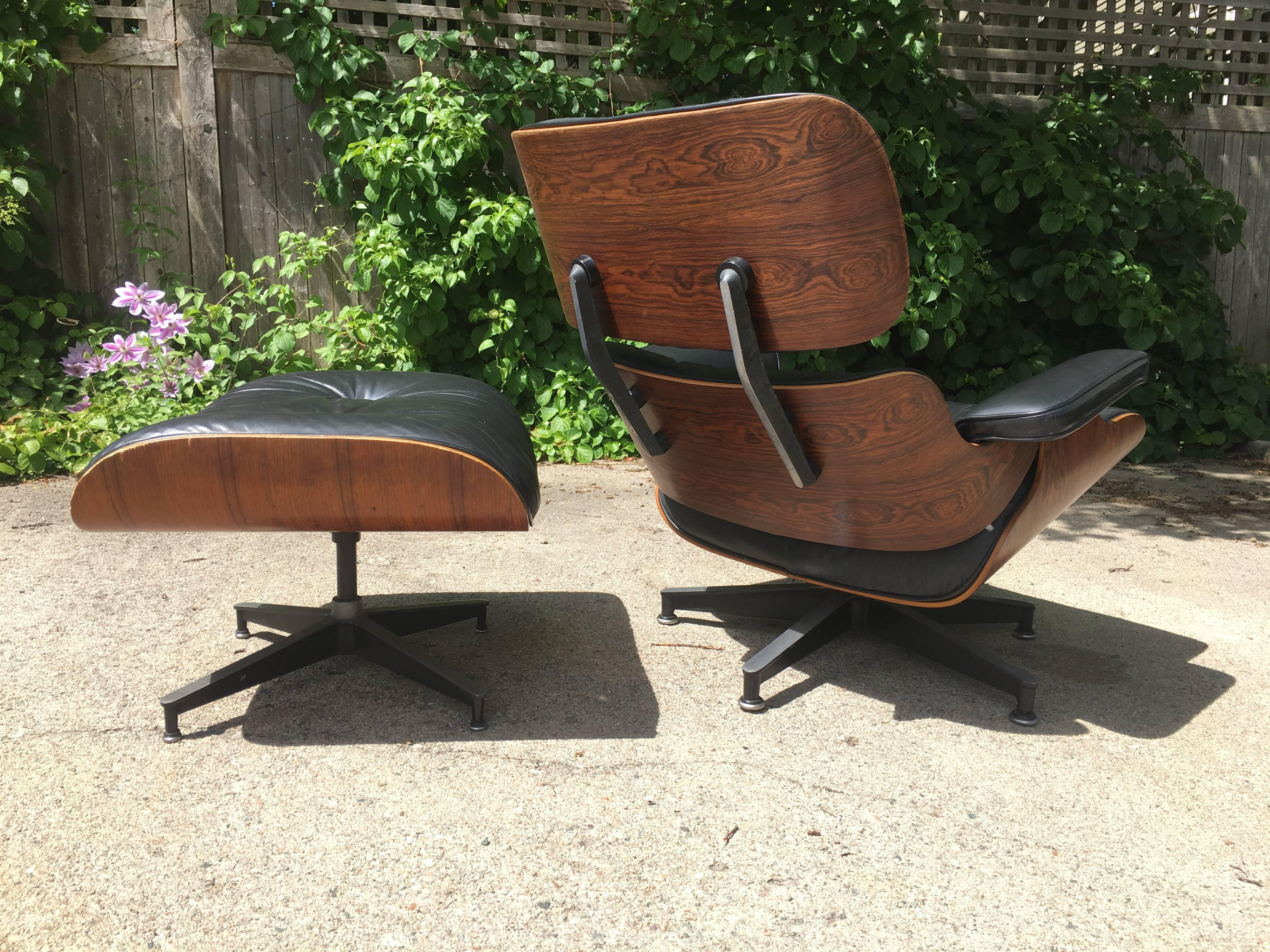 1970s, Herman Miller Eames lounge chair and ottoman in rosewood. From original owner. All original parts. Leather has normal wear but no tears or holes. Rosewood is superb with incredible grain patterns and color.