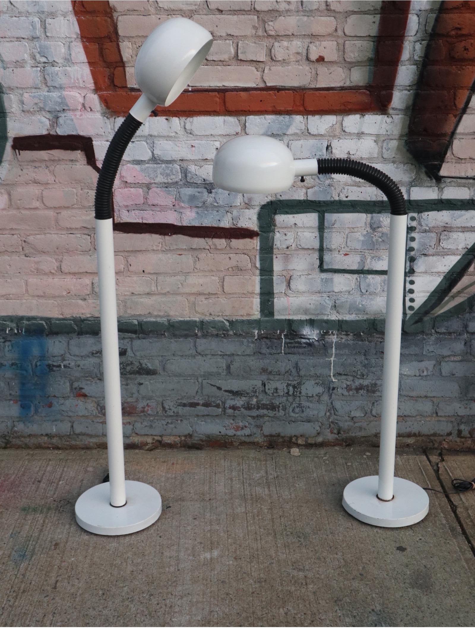 Beautiful pair of modern goods neck floor lamps. Shades pivot to direct light in many directions. Perfect for reading lamps next to a lounge chair, one either side of the sofa, and next to the bed.