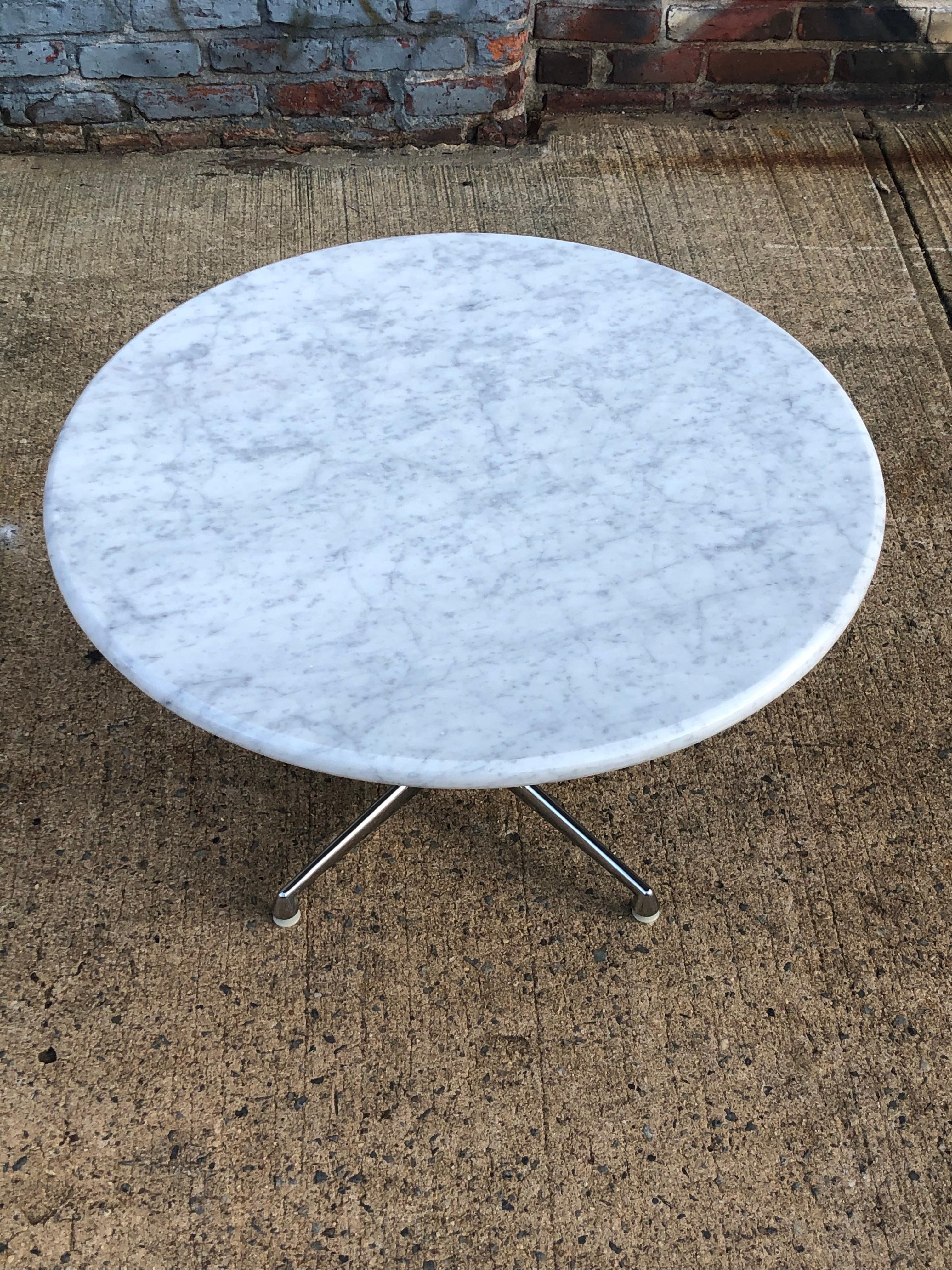 Gorgeous La Fonda coffee table by Charles and Ray Eames and produced by Herman Miller. New white Carrara marble slab with full bullnose rounded edge rests on a top chrome base. The marble is new and custom cut (photo shown is the last one we made,