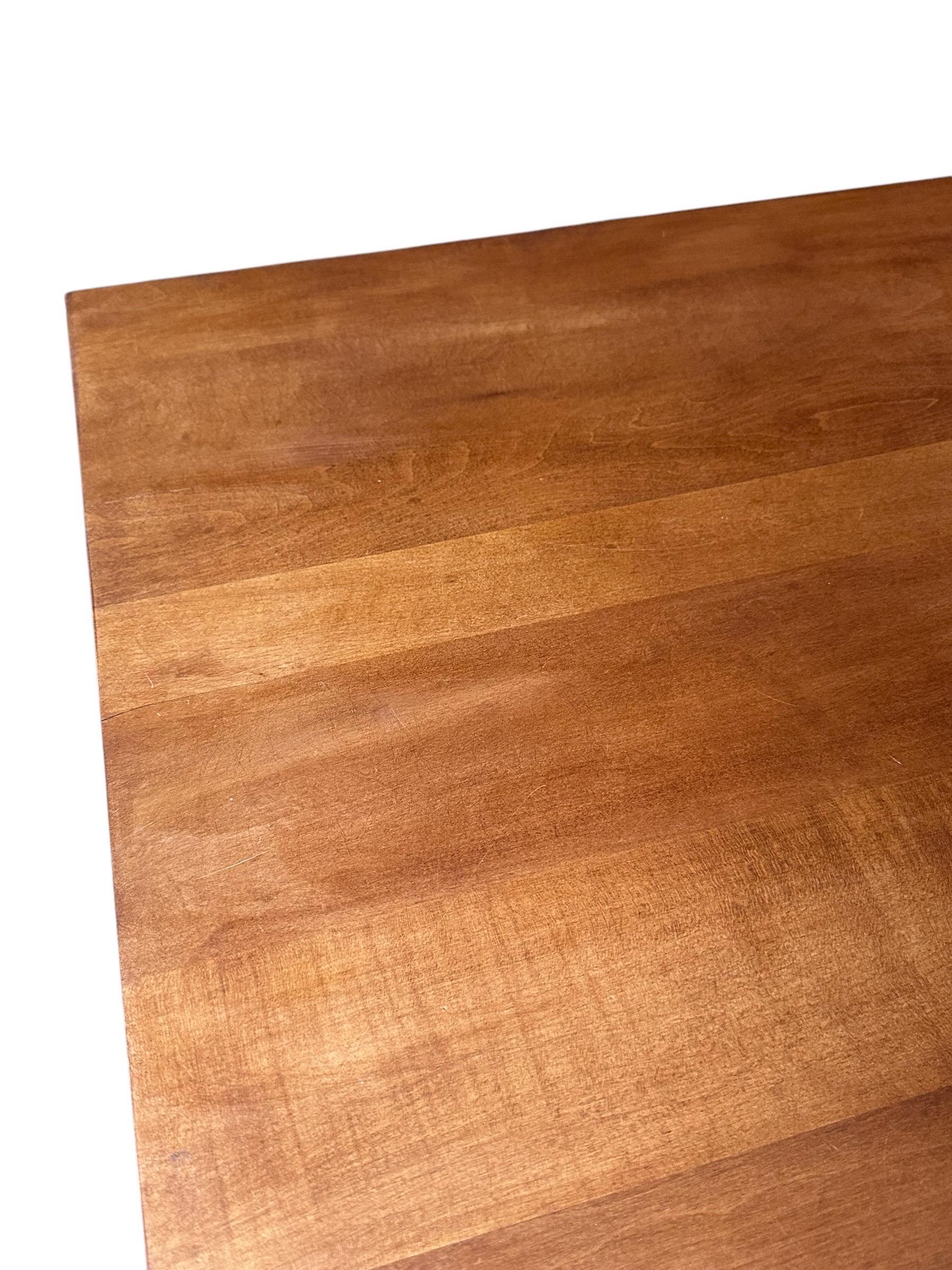 Beautiful solid wood coffee table. From the Planner Group line designed by Paul McCobb for Winchendon Furniture Company. Retains original manufacturer’s label and guaranteed authentic. Simple and elegant lines with original pulls and refinished