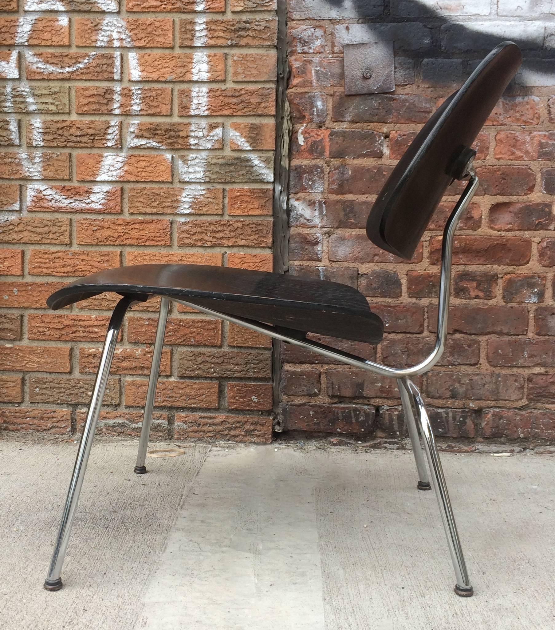 Eames Evans aniline dyed black LCM. Dates to 1940s. No pitting to chrome frame. No dings or damage to wood. In exceptional vintage condition. All original mounts, screws, and screw in domes of silence glides. Nearly immaculate. Unrestored original