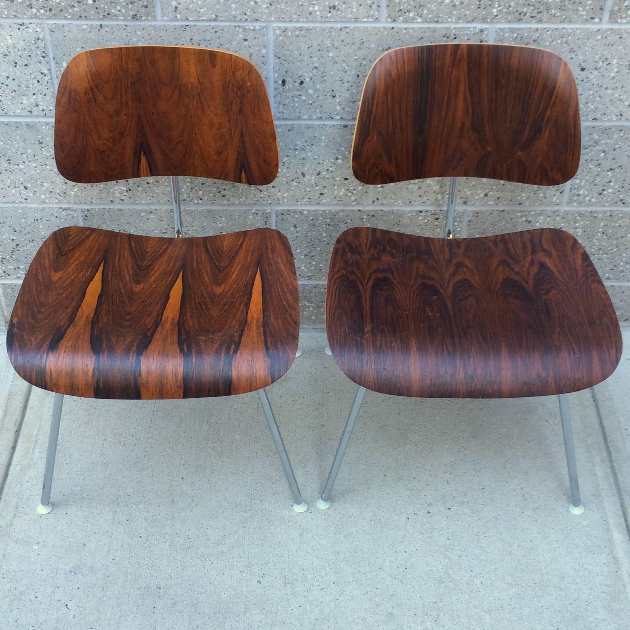 Highly figured Eames Herman Miller Rosewood DCM pair from the 1970s. Exceptionally rich color and grain contrast. All original. No pitting to frames.