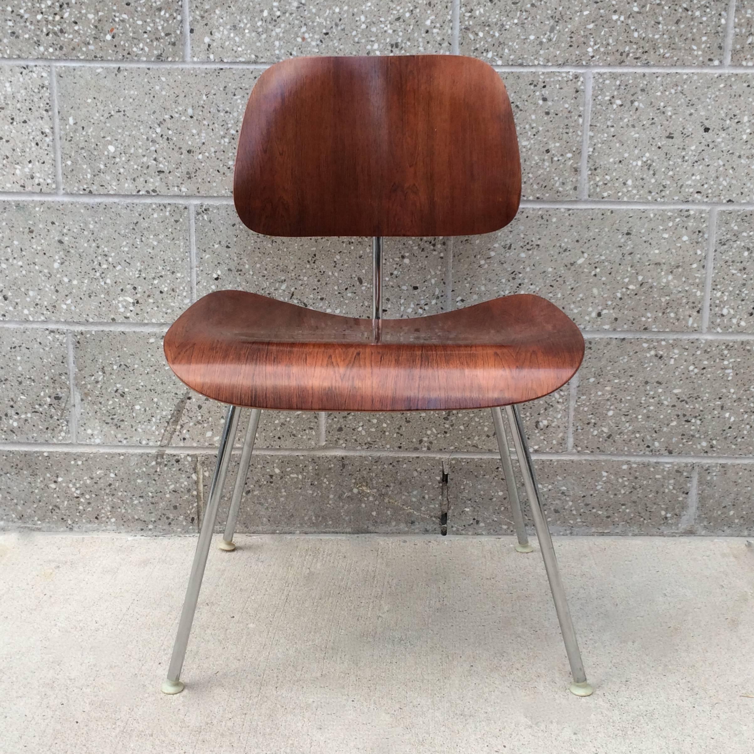Herman Miller Eames rosewood DCM. Rich color and grains. Frame in excellent condition with no rust. Back mounts were replaced. No veneer damage.