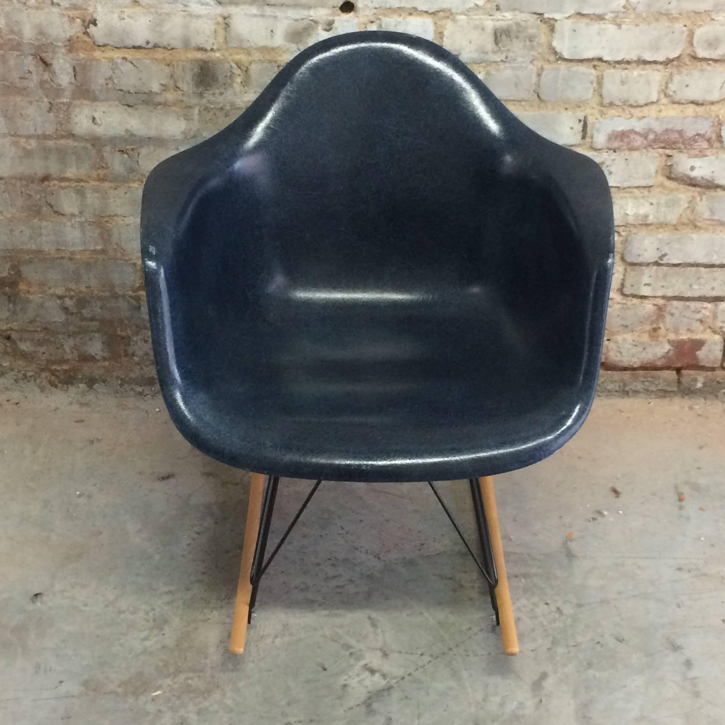 Navy blue Herman Miller Eames rocker on new base. Chair dates to late 1950s. Excellent condition with no fading or cracks. Normal wear from age and use. Base available in chrome as well. Runners in birch.