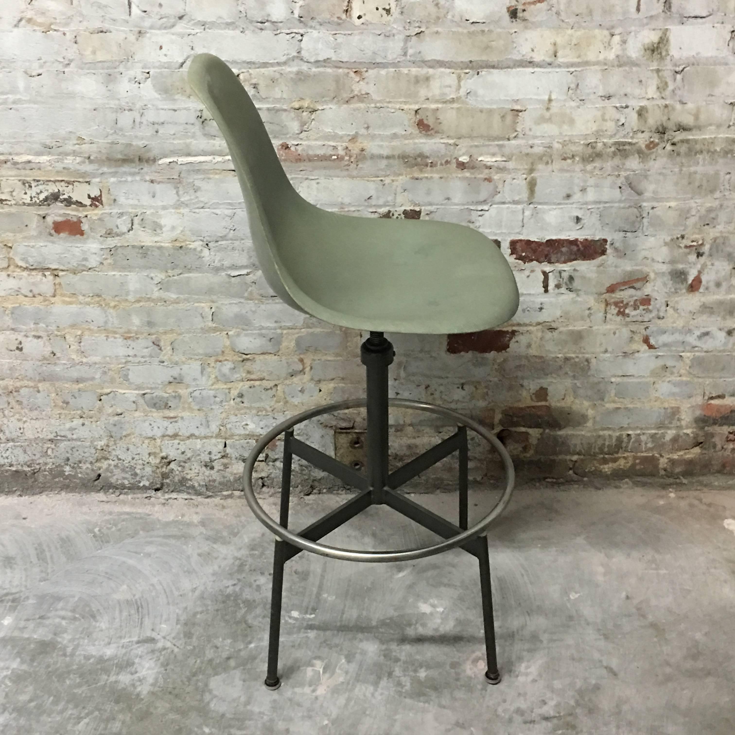 Herman Miller Eames seafoam green shell on rare architect's drafting base. Shell near perfect. Adjustable height base with swivel. In excellent condition.