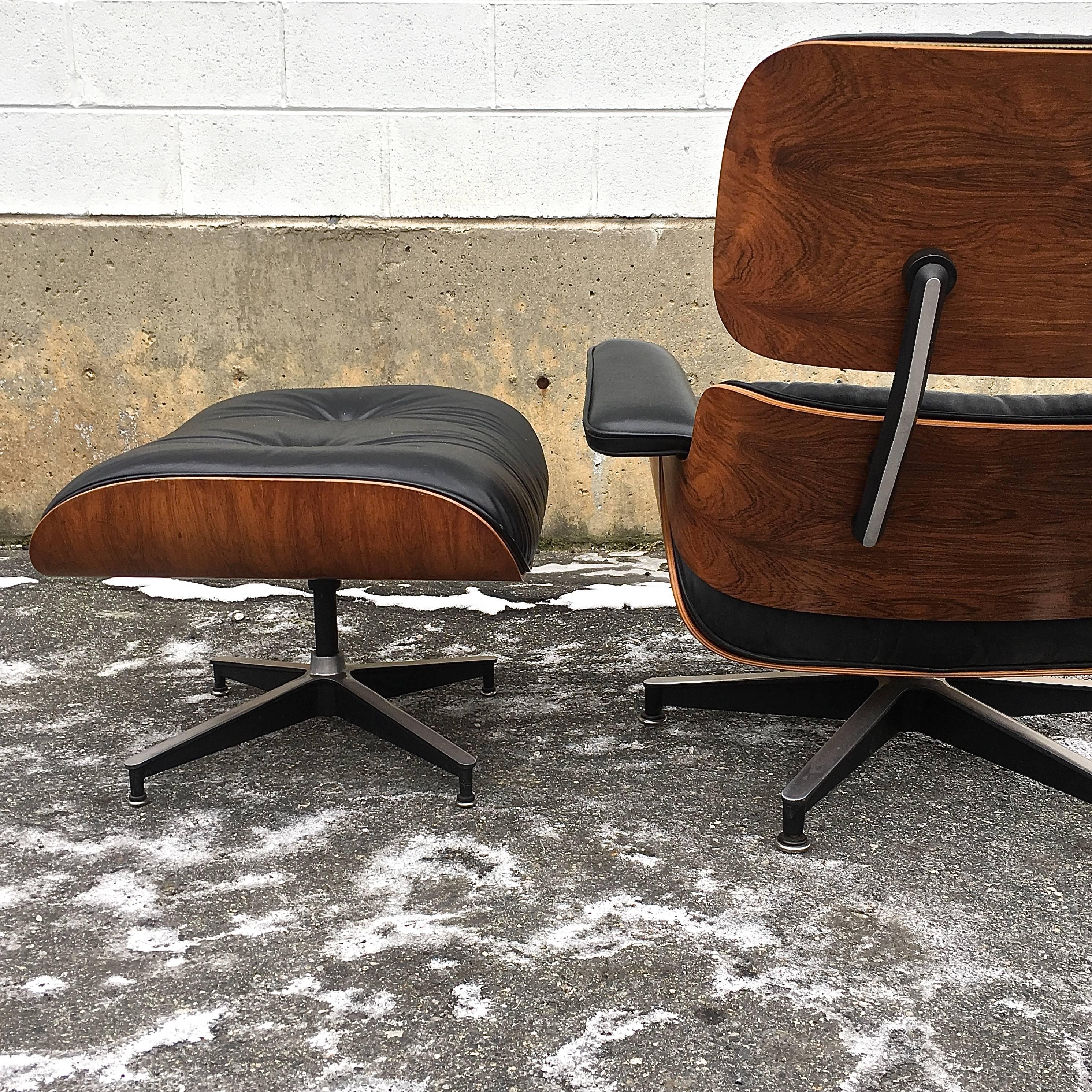 Herman Miller Eames lounge and ottoman in Brazilian rosewood. Chair marked May 7, 1975. All original. Leather in very good condition and rosewood shells boast lovely patina and color. 