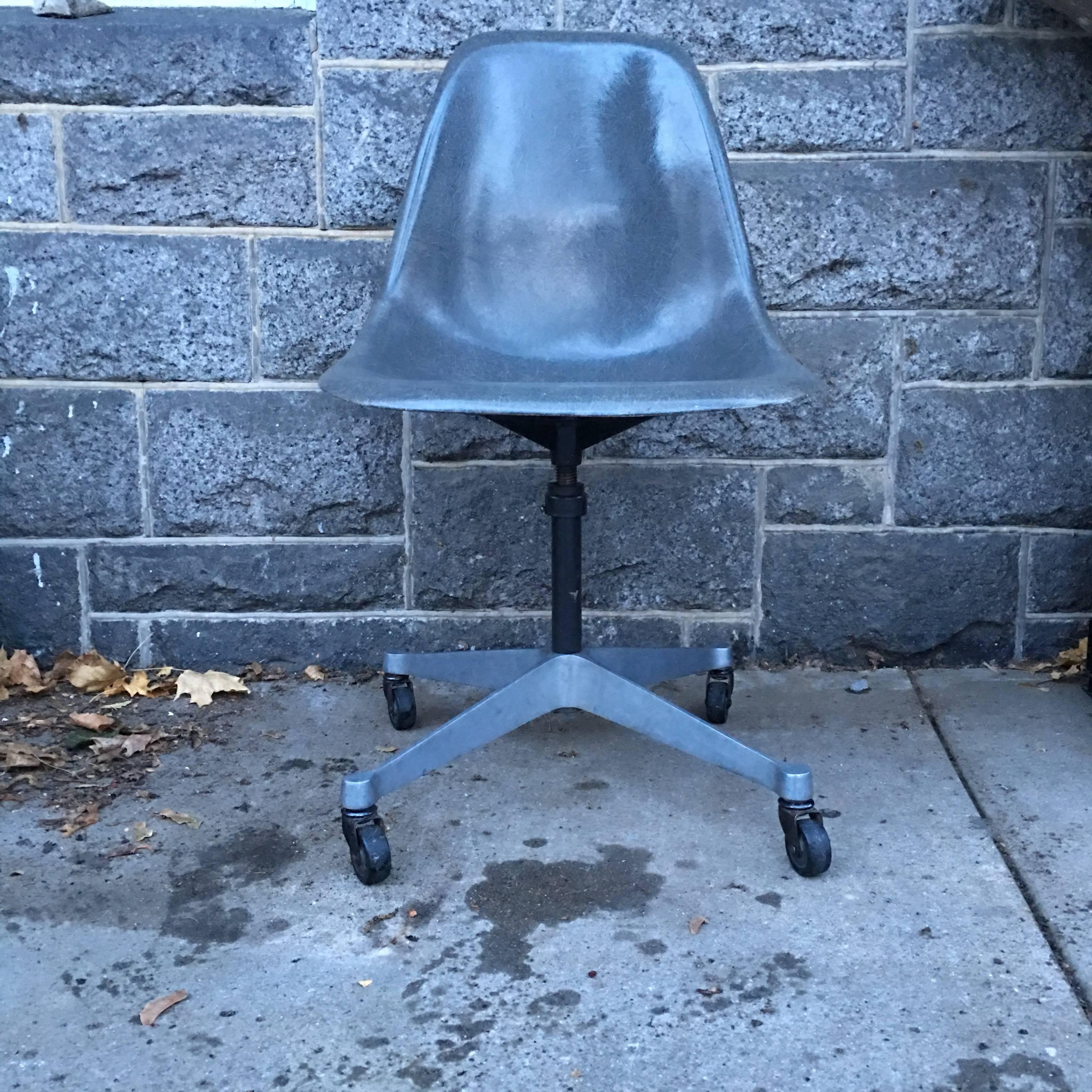 Vintage Herman Miller Eames elephant grey swivel desk chair. Adjustable height base. No fading or damage. In excellent vintage condition. Pair available.