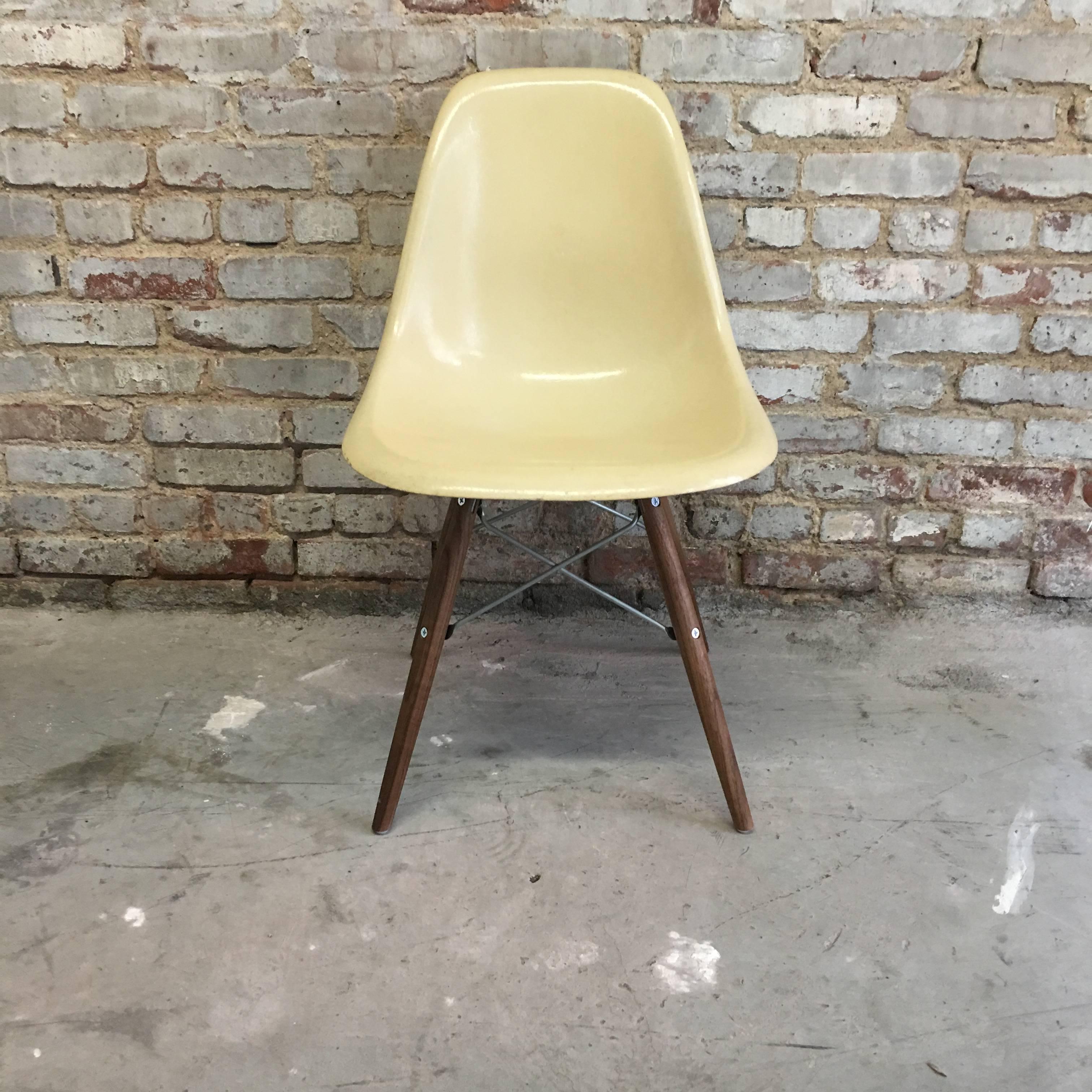 Eight Herman Miller Eames DSW dining chairs in parchment. Excellent condition with new modern Conscience bases. Sold in sets of six or eight. Wood legs available in maple, birch or walnut (pictured). Metal available in black or zinc (pictured).