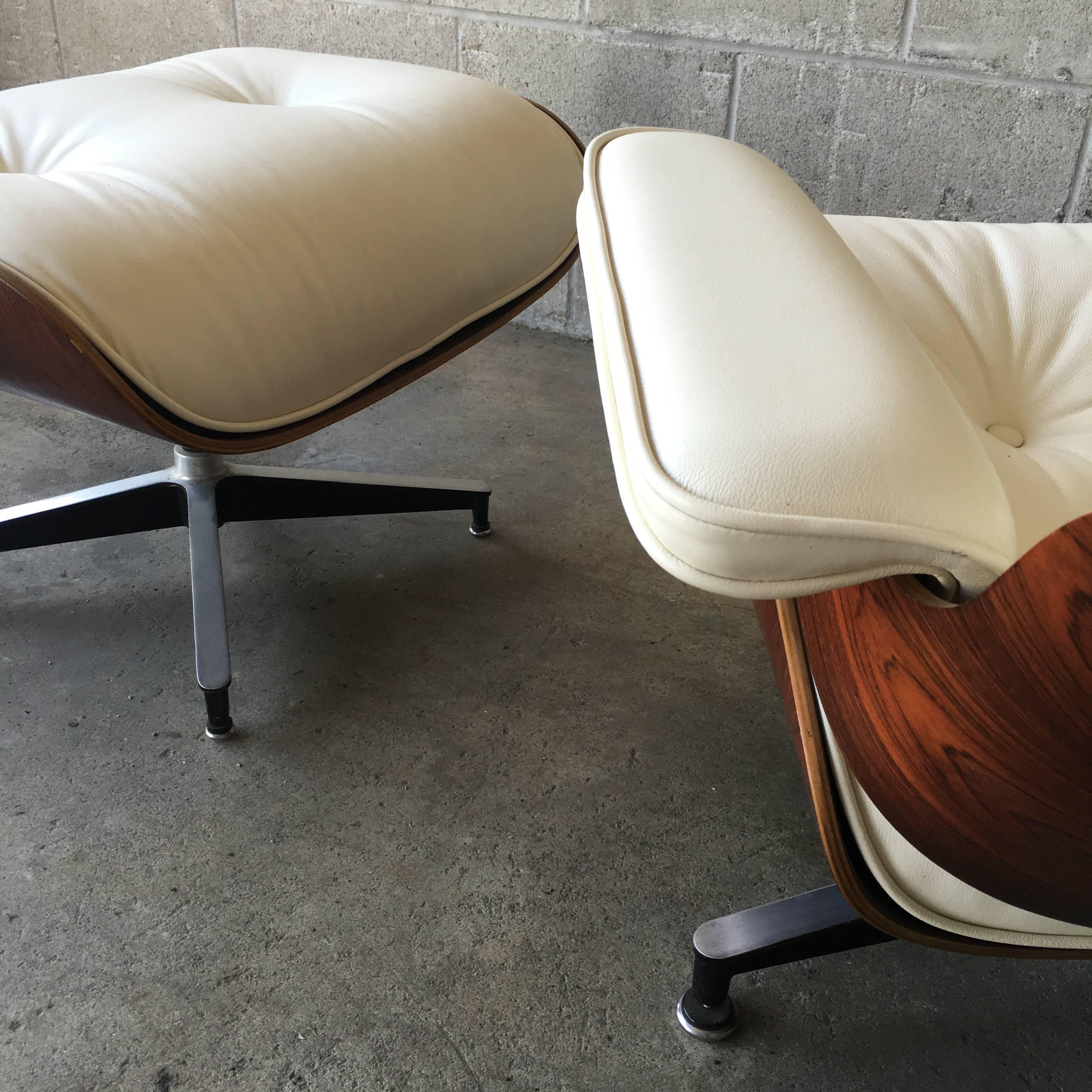 Herman Miller Eames lounge chair and ottoman in Brazilian rosewood and new ivory leather cushions. Rosewood refinished in excellent condition. New shock mounts installed in seat panels ($60” value). Signed and guaranteed authentic. Cushions made to