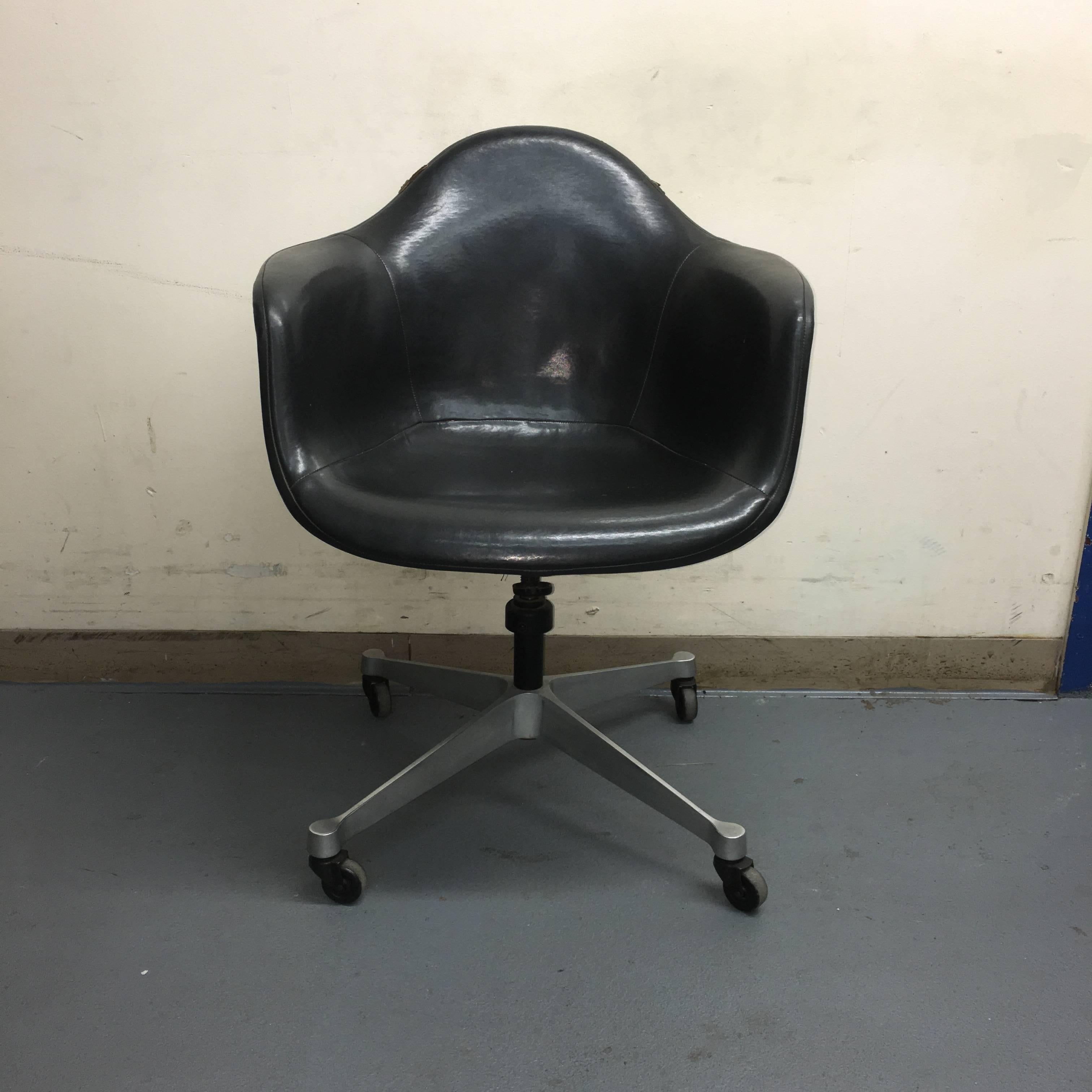 Eames for Herman Miller DAT-1 swivel desk chair. Aluminum base has all four casters in working condition. Removable Naugahyde cover in very good condition with only two minor wear spots along rail, but to splits in seams or burns etc. Tilt swivel