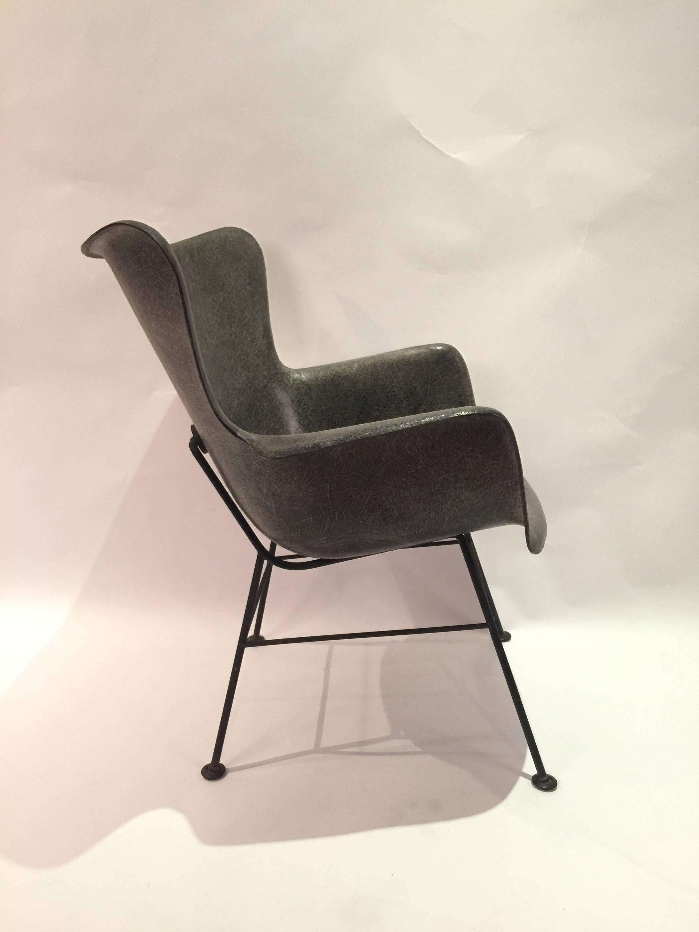 Graphite grey fiberglass wingback shell chair by Lawrence Peabody for Selig. An alternative to the Classic Eames fiberglass chair. Lovely surface nuance and patina. And wonderful pattern to the fiberglass. Has original foot glides and shock