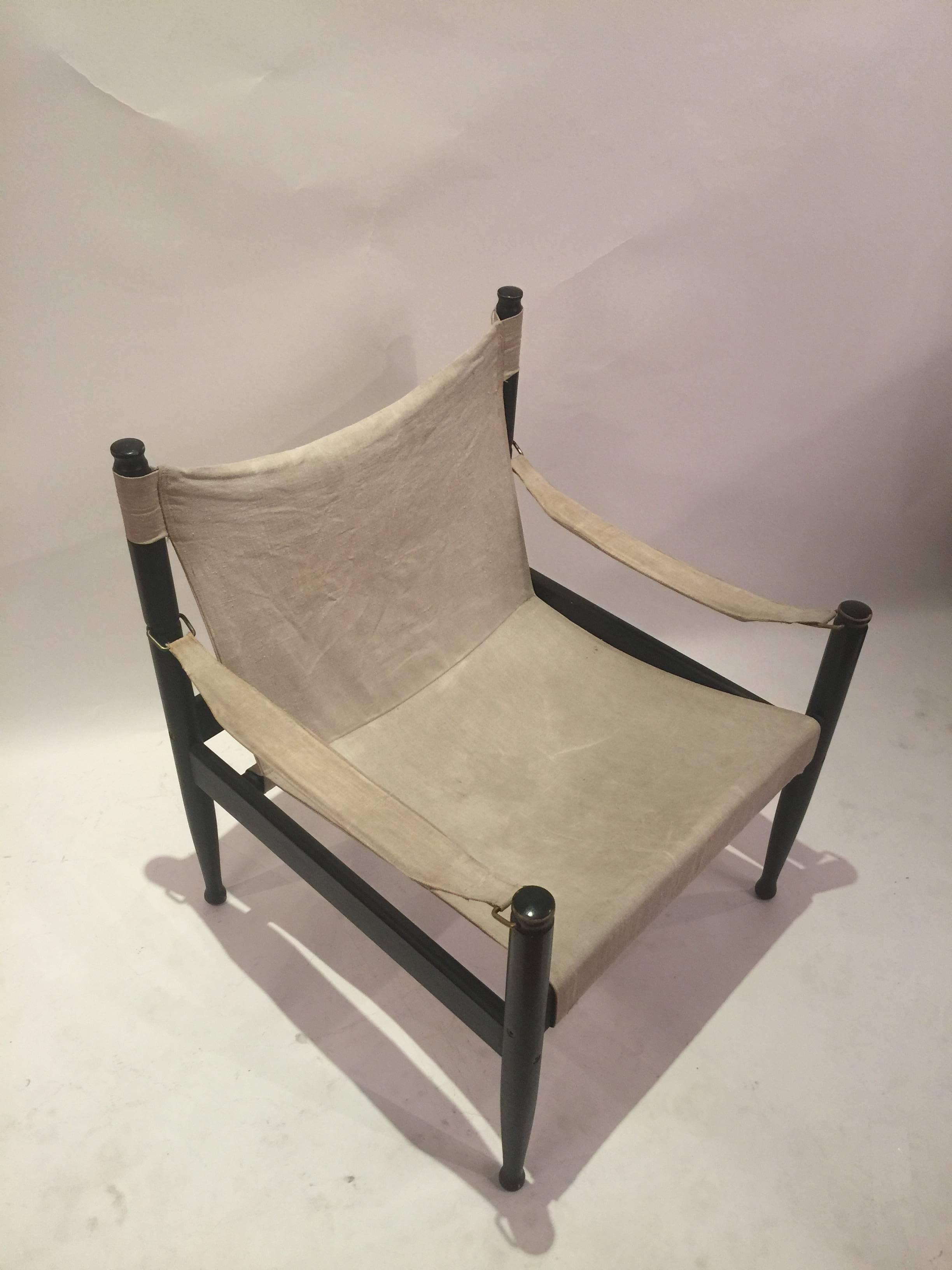 Erik Worts refined take on the Safari chair perfectly blends modernism and rustic aesthetic. The chair is made of black lacquered beech. Good condition, might show a little be of wear to the lacquer. The chair can be taken apart and put back