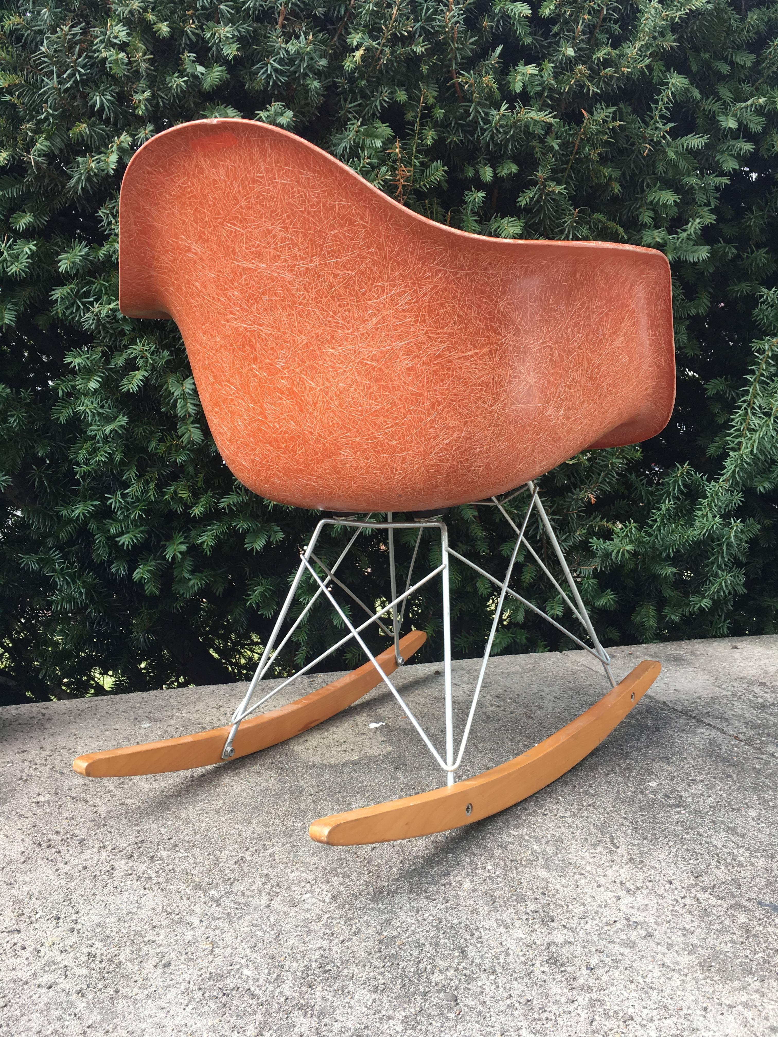 Herman Miller Eames terra cotta RAR rocking chair. Extremely rare color. Gorgeous strong fibers. Vintage Herman Miller base in excellent original condition.