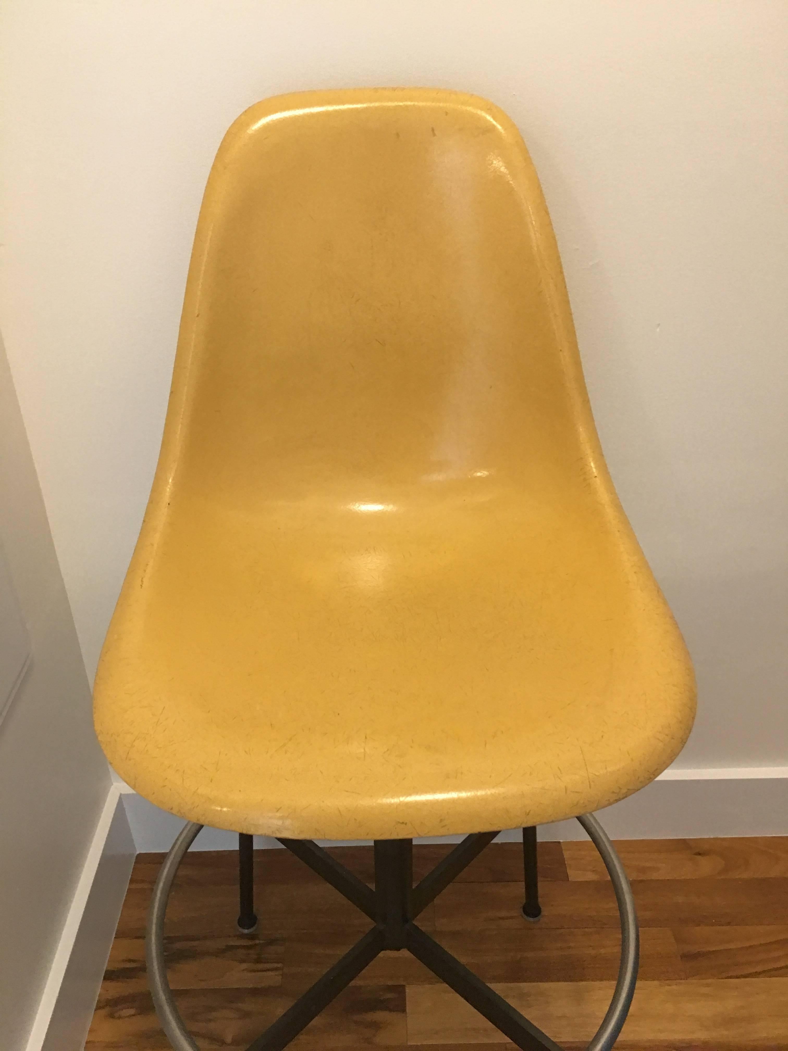 Eames for Herman Miller Architect's drafting stool or chair. Ochre colored fiberglass in excellent condition with no cracks or holes. The height is easily adjustable. Base in excellent original condition with all glides present. Nothing is missing