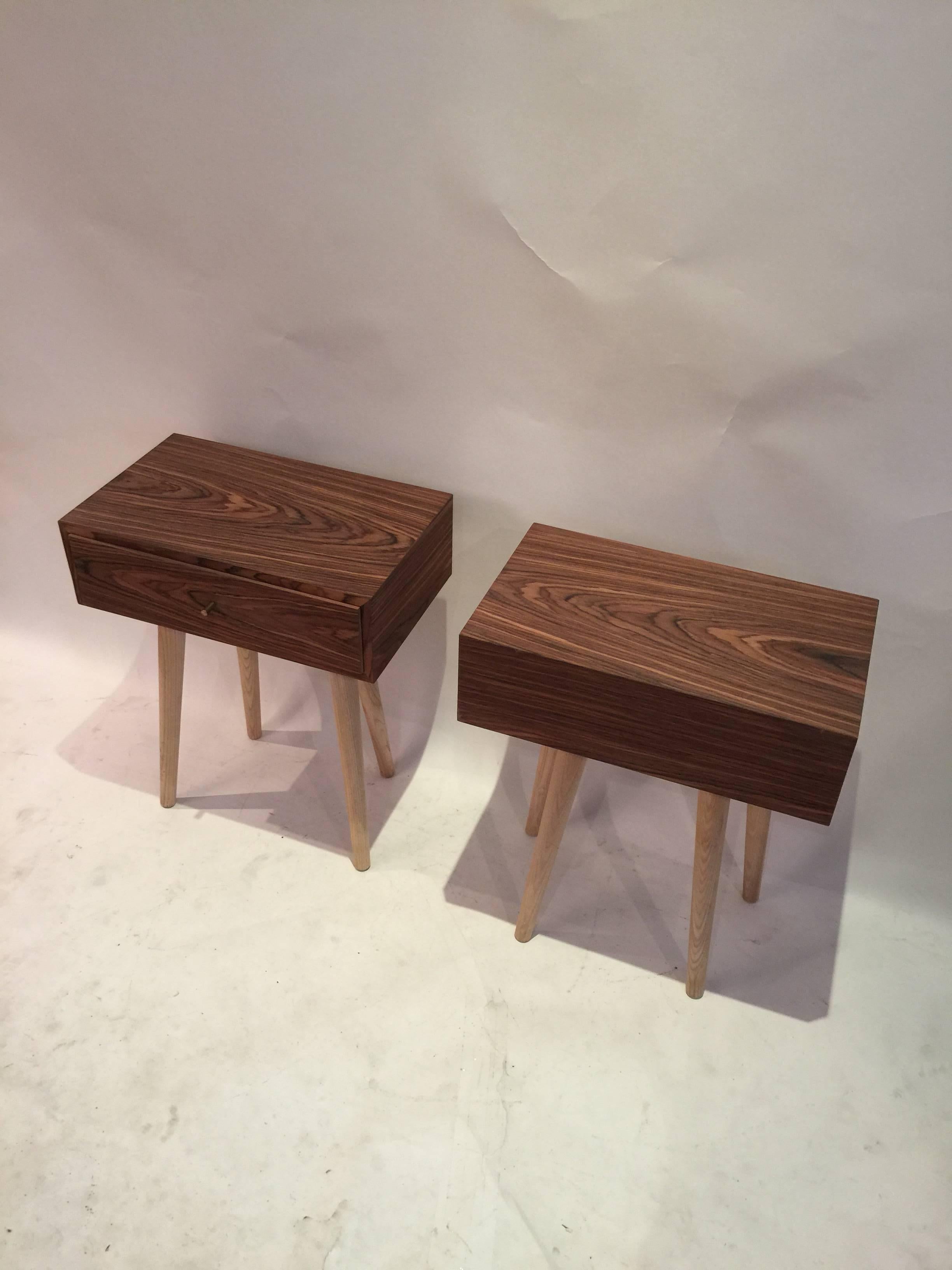 Pair of old growth recycled rosewood and blonde ash legs accented by brass pulse and heavy duty hardware. Striking minimal design by Danish furniture maker Re.collection.
    