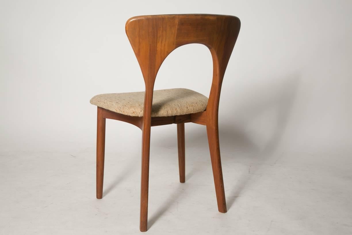 Chair in teak by Niels Koefoed model "Peter" from the 1960s. Beautiful chairs in Scandinavian design from the 1960s ideal for the living room. The wood is in mint condition except for area rear screw entry underneath the seat has been