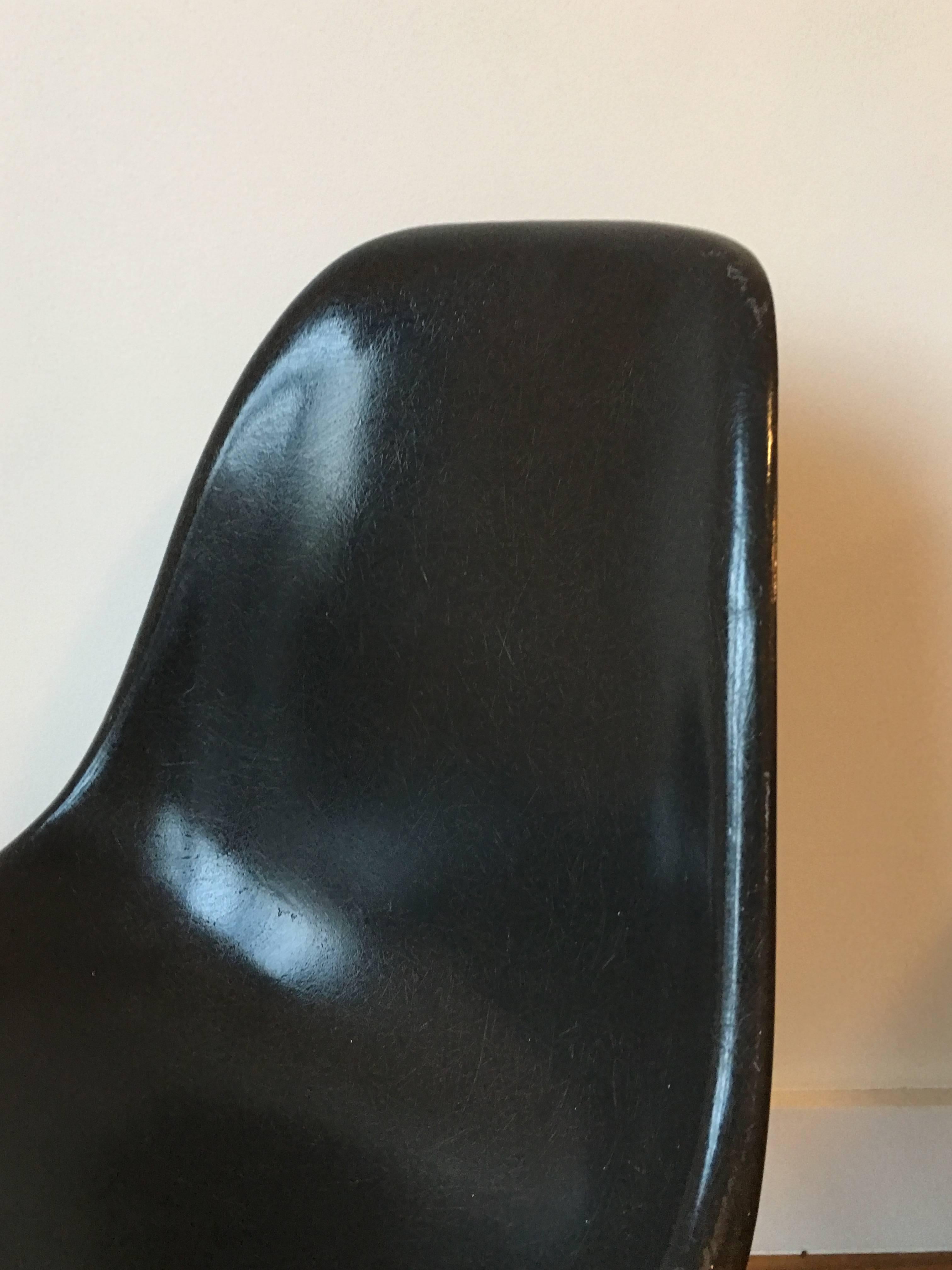 Ten Herman Miller Eames DSW dining chairs in rare color: Black. This was a special order color and it is rare to save a set this big. New bases available in maple, or walnut legs with zinc plated or black metal frames. Shown with black frame and