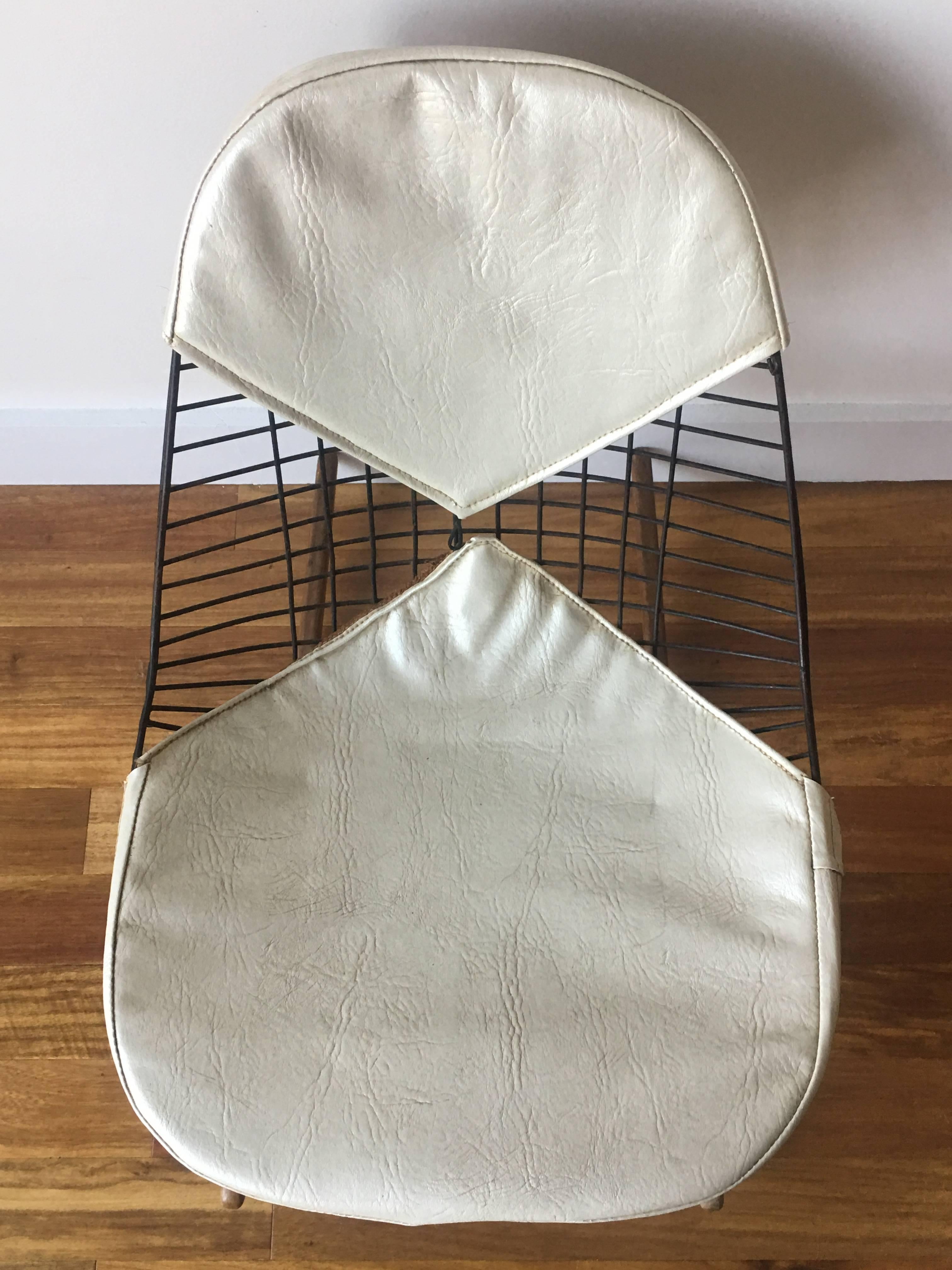 Early original Herman Miller Eames RKR. Original pads. Signed. Expert repair to side edge. Lighter spot on front left runner. Can be oiled at no charge. Hairline fissure to one runner but chair is sat in regularly.