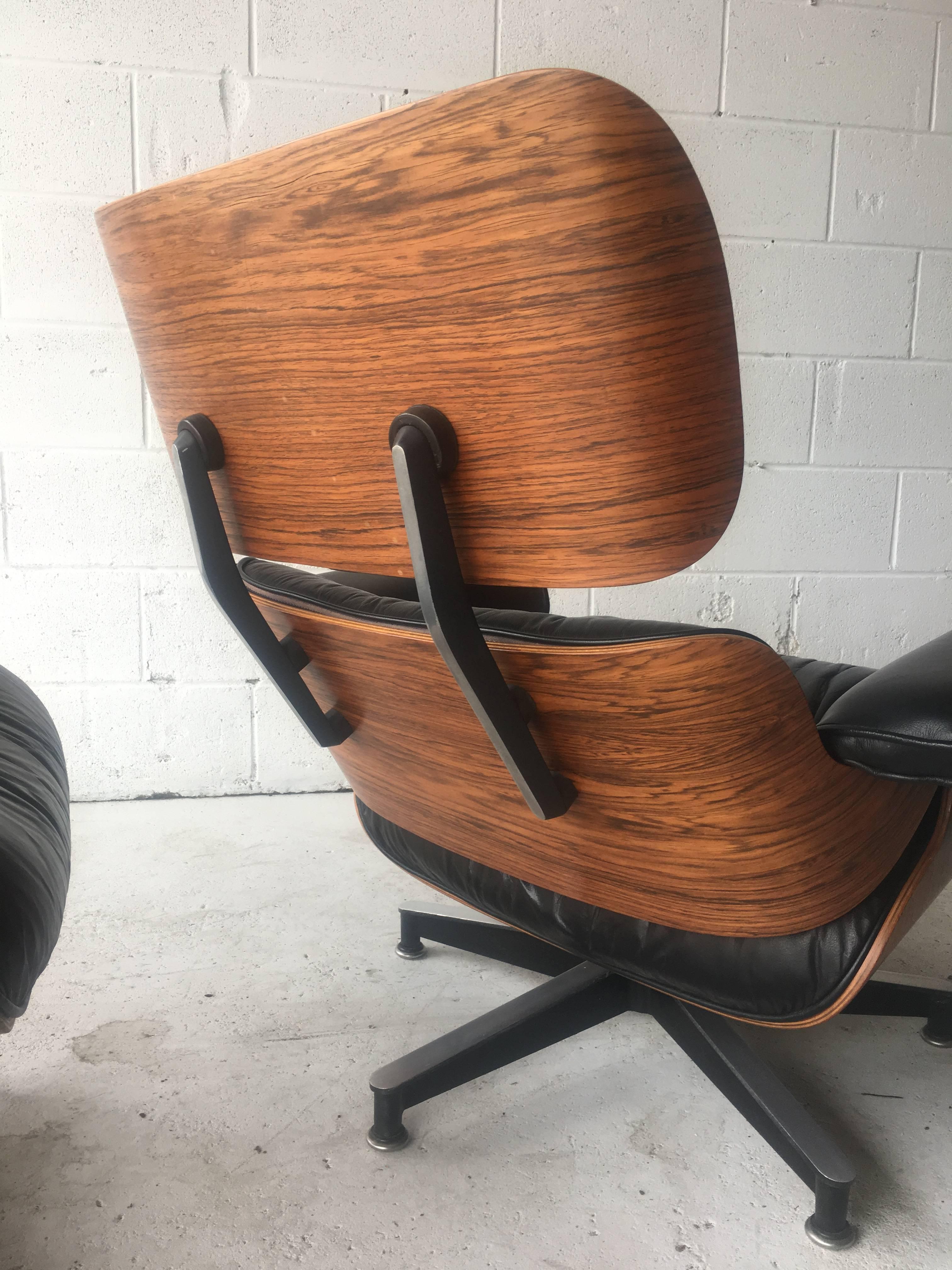Herman Miller Eames lounge and ottoman in black leather. All original. Very good condition, early 1970s set. No tears to leather. Signed. Ships disassembled.