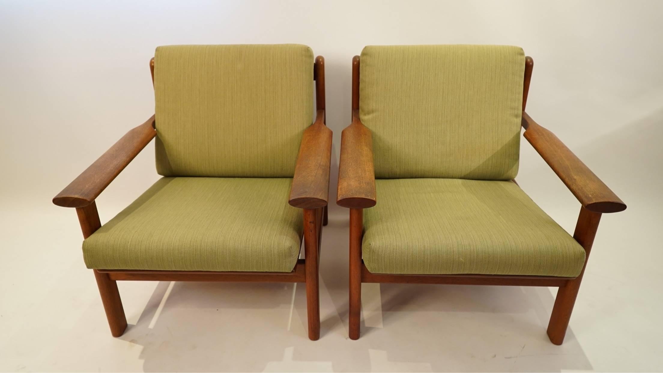 Exceptional danish craftsmanship executed in teak by designer Poul Volther for manufacturer Frem Rølje. These chairs were produced in the late 50s. The design features: back uprights with rounded finals, paddle armrests with notched ends, back