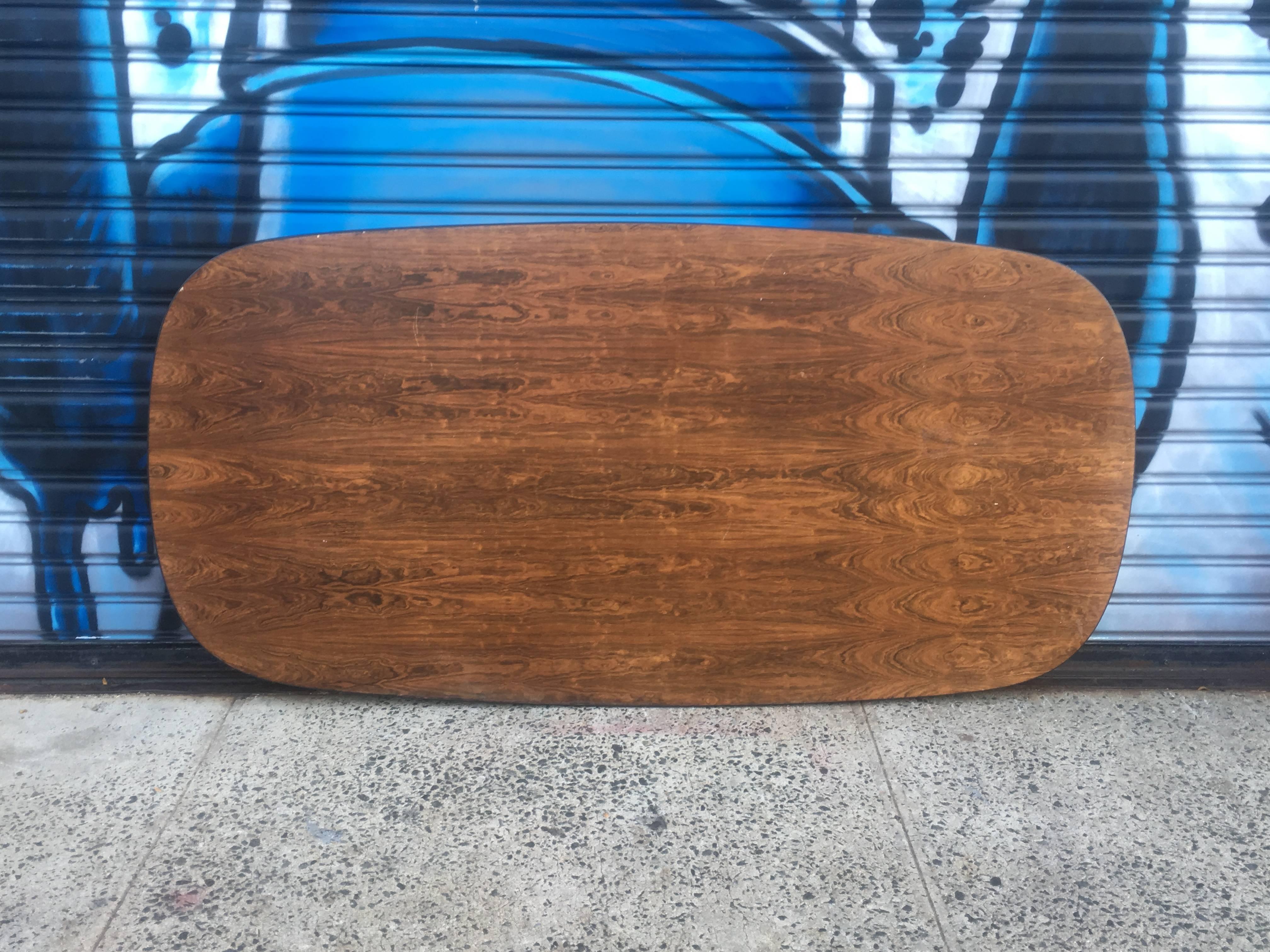 7 foot Herman Miller Eames rosewood conference of dining table. In good condition with normal wear. Aluminum segmented base. Purchased from original owner, and architect who had this as he conference table at his firm on Fifth Avenue in the