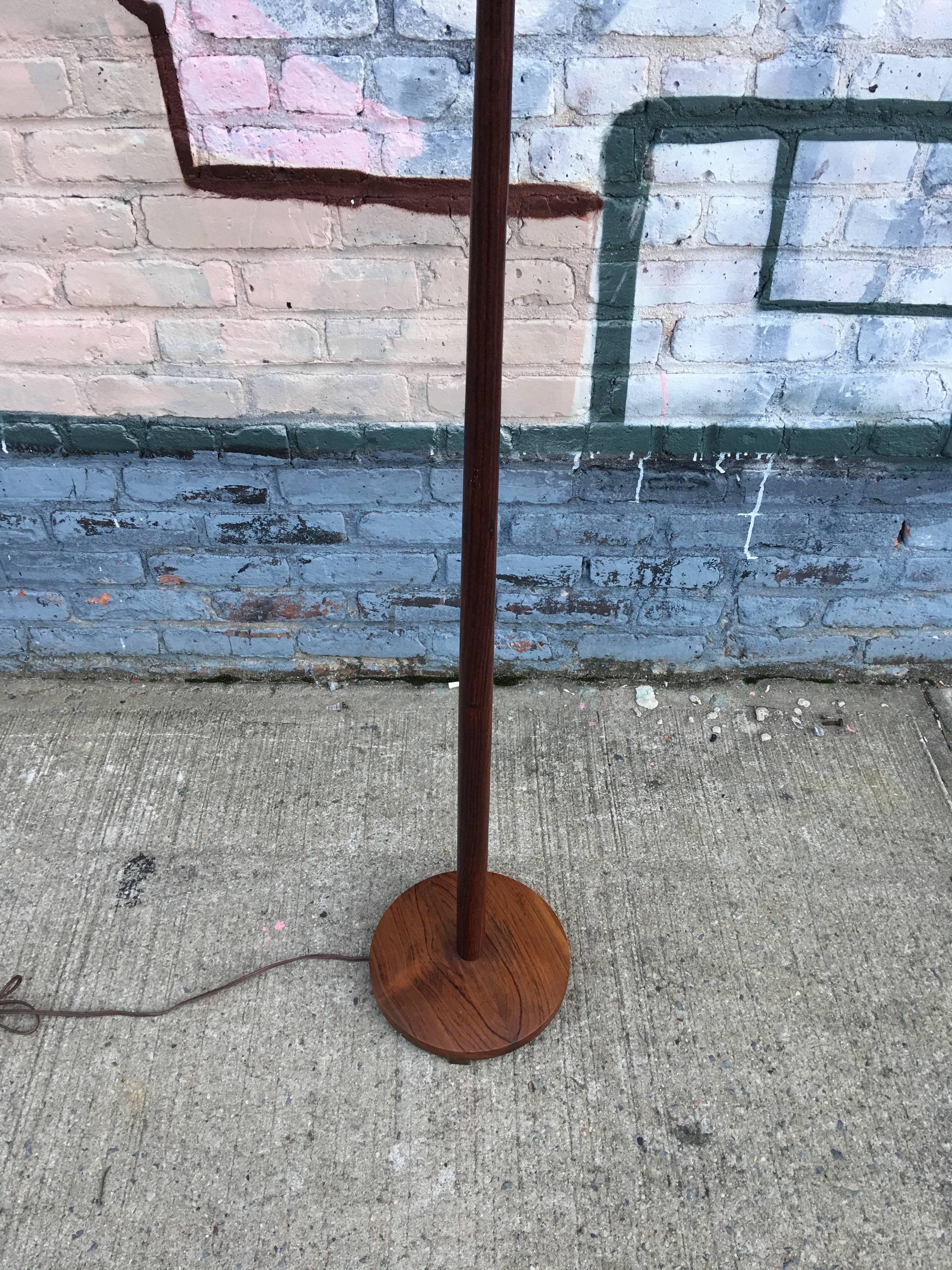 Swedish rosewood floor lamp. In superb condition with original shade.