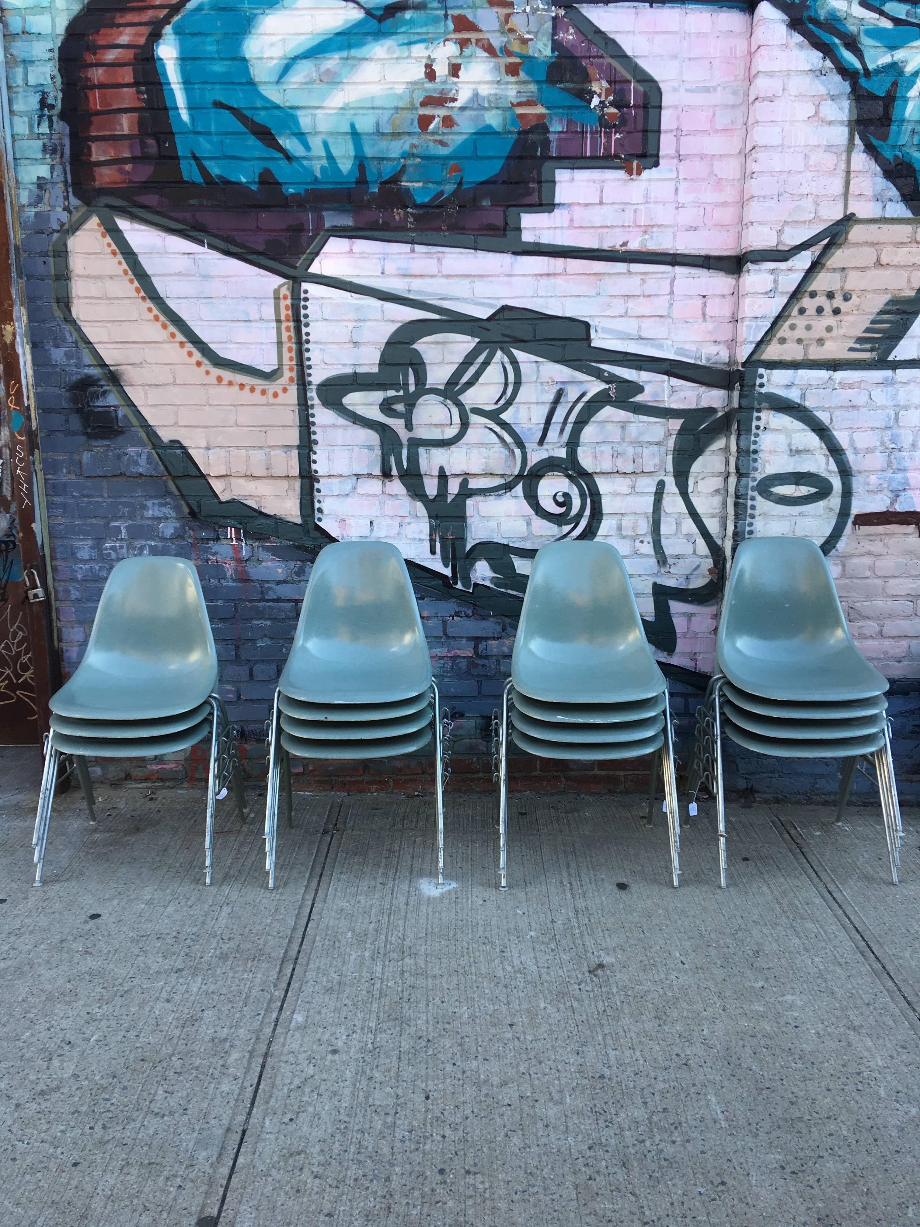 Herman Miller Eames stacking dining chairs in rare and coveted Seafoam green. Very difficult to find in this quantity. No cracks or holes. In excellent vintage condition. Some bases in photos are missing glides but will be replaced with vintage
