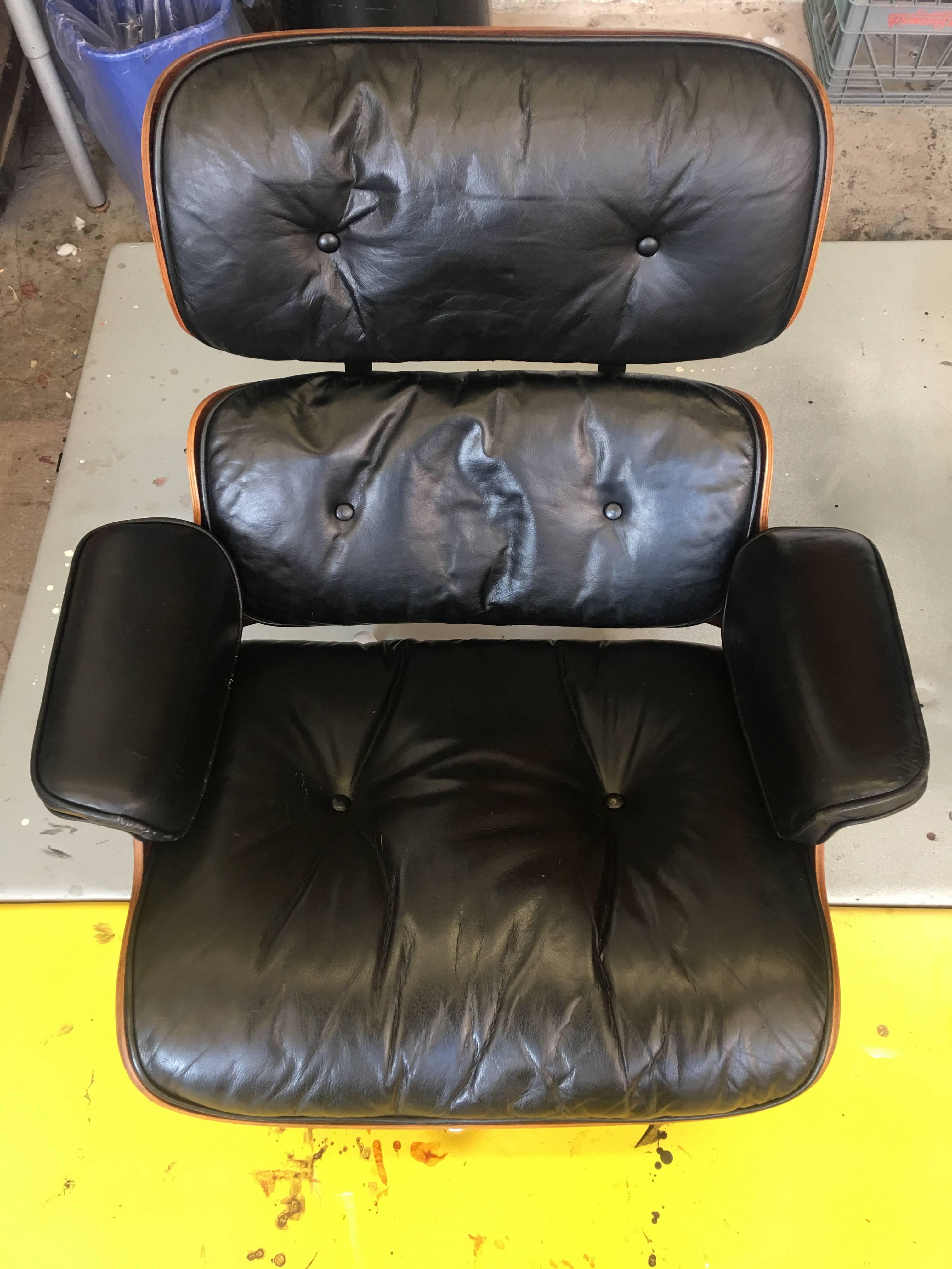 Rare Herman Miller Eames lounge from the first few months of production in 1956, with elusive and iconic spinning ottoman. There are not more than a couple dozen out there (if that many). Leather in excellent condition. Ottoman original to chair.
