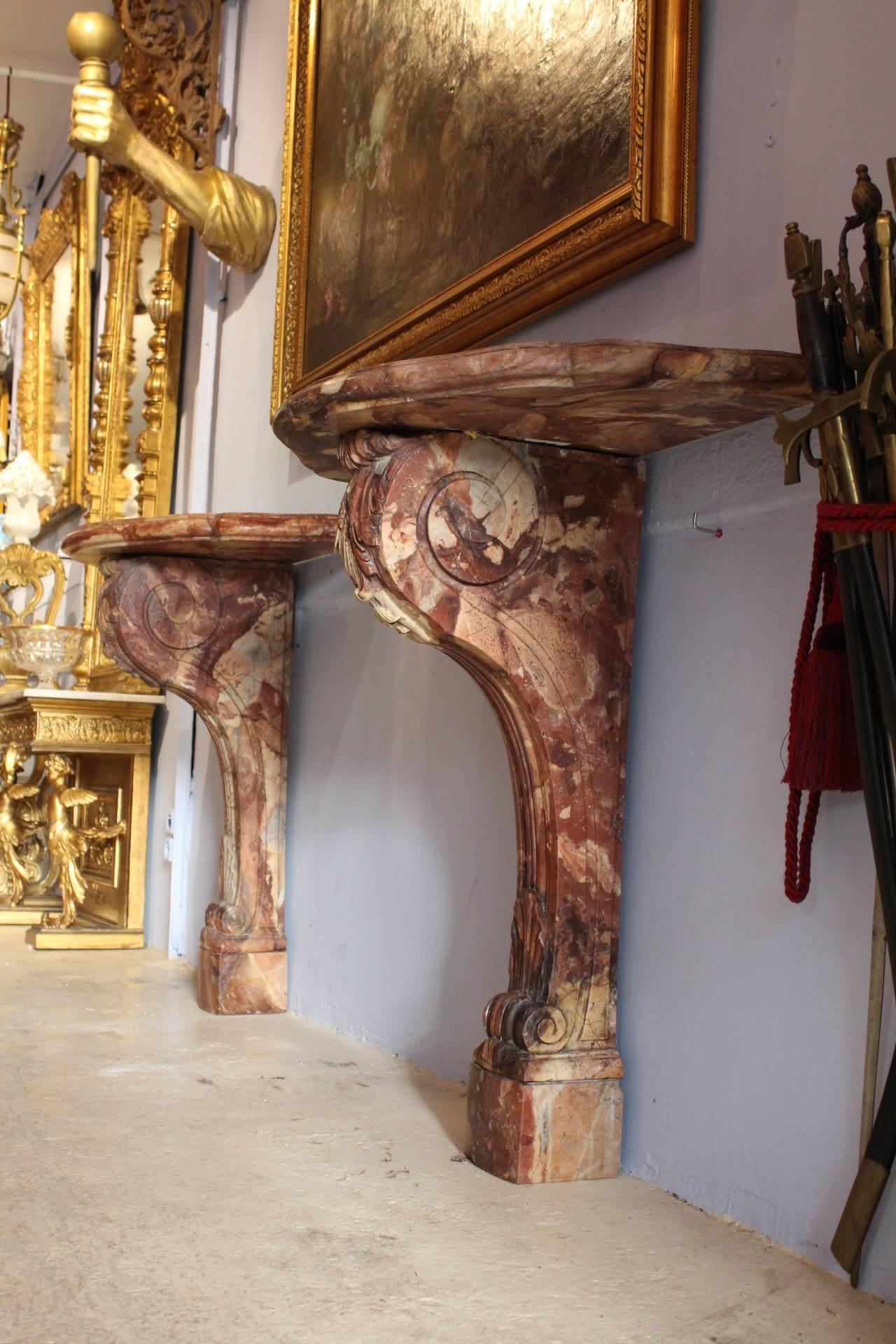 Pair of Console Tables
Marble
Circa 1880 / 19th Century
France 

This beautiful original pair of console tables, in Louis XV spirit, is impressive by the quality of sculpting work, which enhances the natural details of the red marble. 