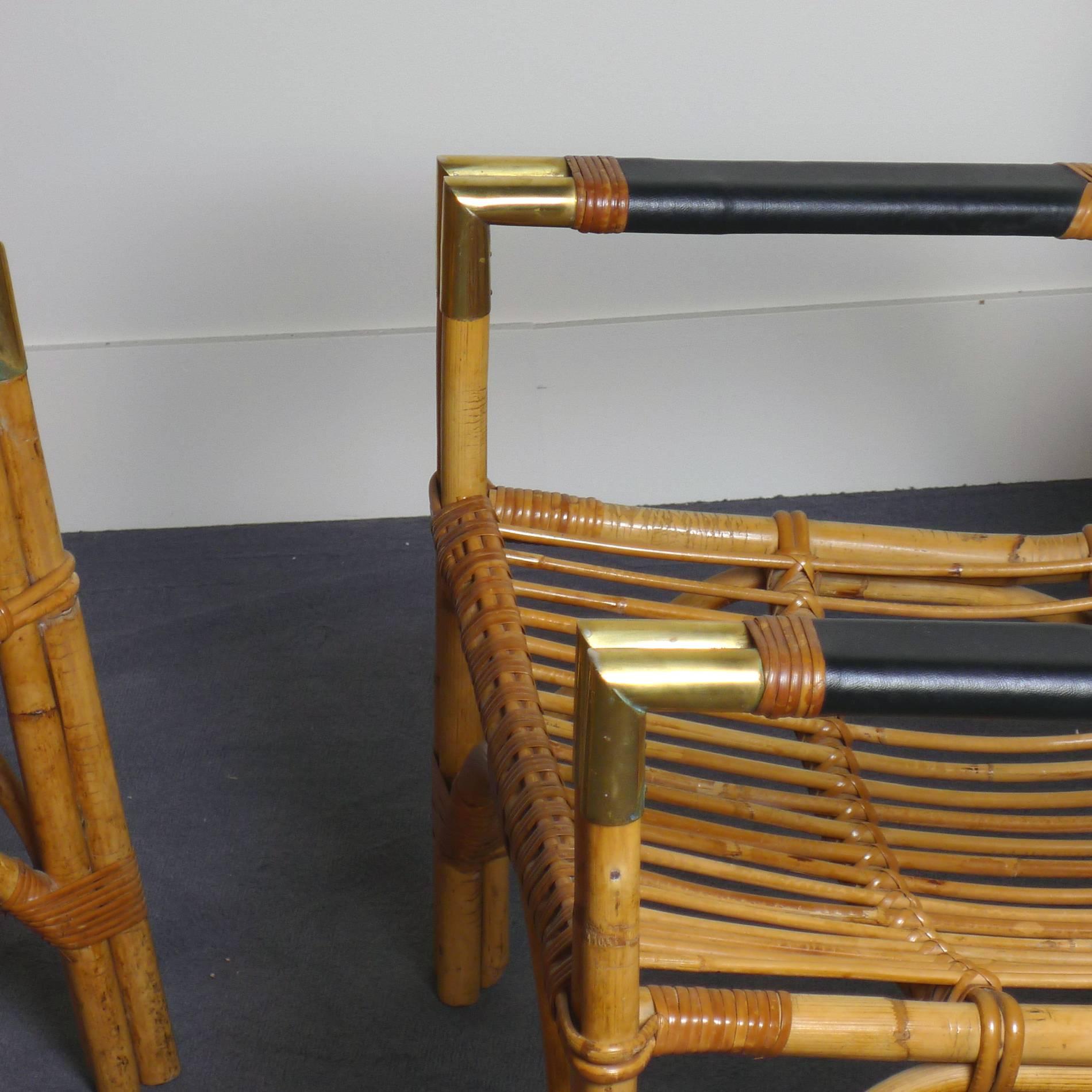 Pair of armchairs in rattan, angle arms in brass and leather finishing circa 1950