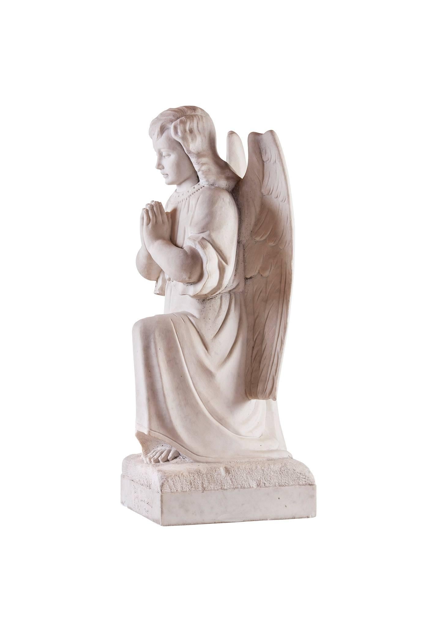 Angel kneeling and praying. Very nice face an expression.