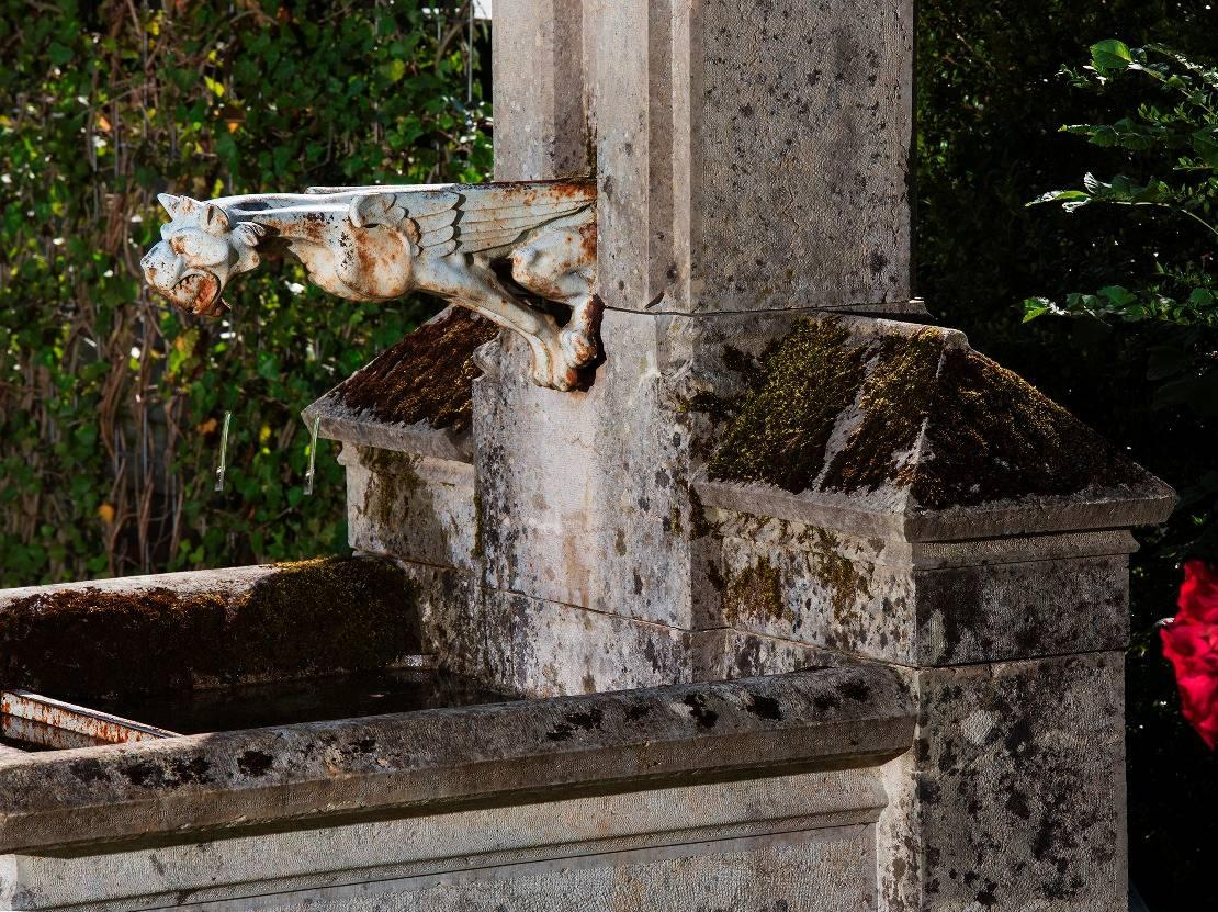 Shown here is a rare castle fountain originating from Loire, France. This unique fountain was made by Limestone in 1880 and still has an original feature - its spouter (only the emblem of the lion has had to be restored and is now in stainless