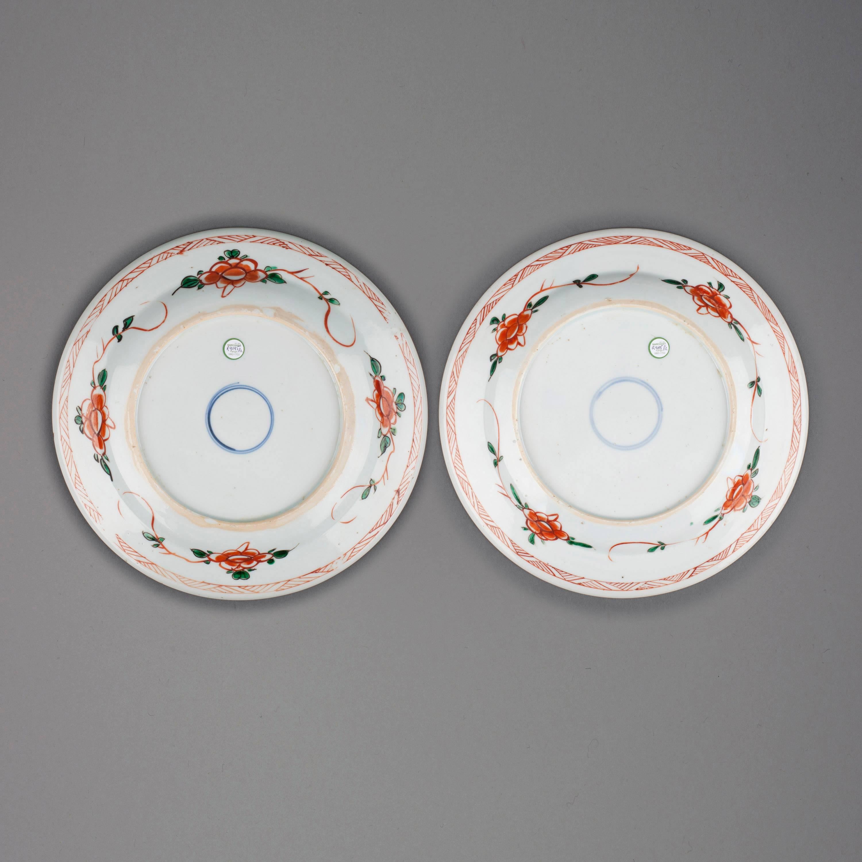 Pair Chinese export porcelain famille verte plates each painted in the centre with a bird perched on a flowering branch amongst pomegranates, the everted rim with four panels enclosing fish and shrimp reserved on an iron red lotus and seed green
