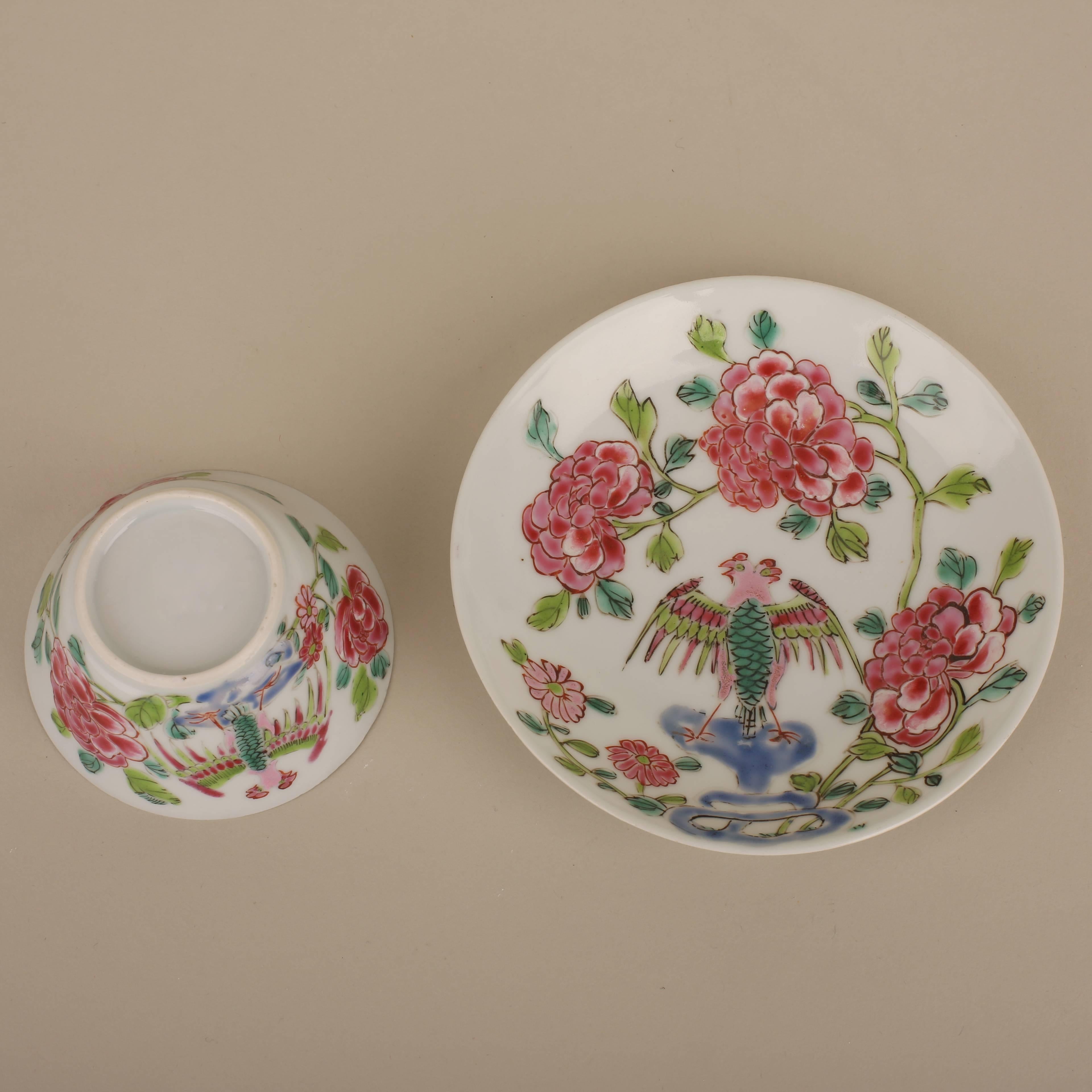 A Chinese porcelain semi-eggshell famille rose circular cup and saucer painted with a phoenix on rockwork surrounded by flowering branches, the cup painted on the outside with a phoenix surrounded by flowers, the interior with a single