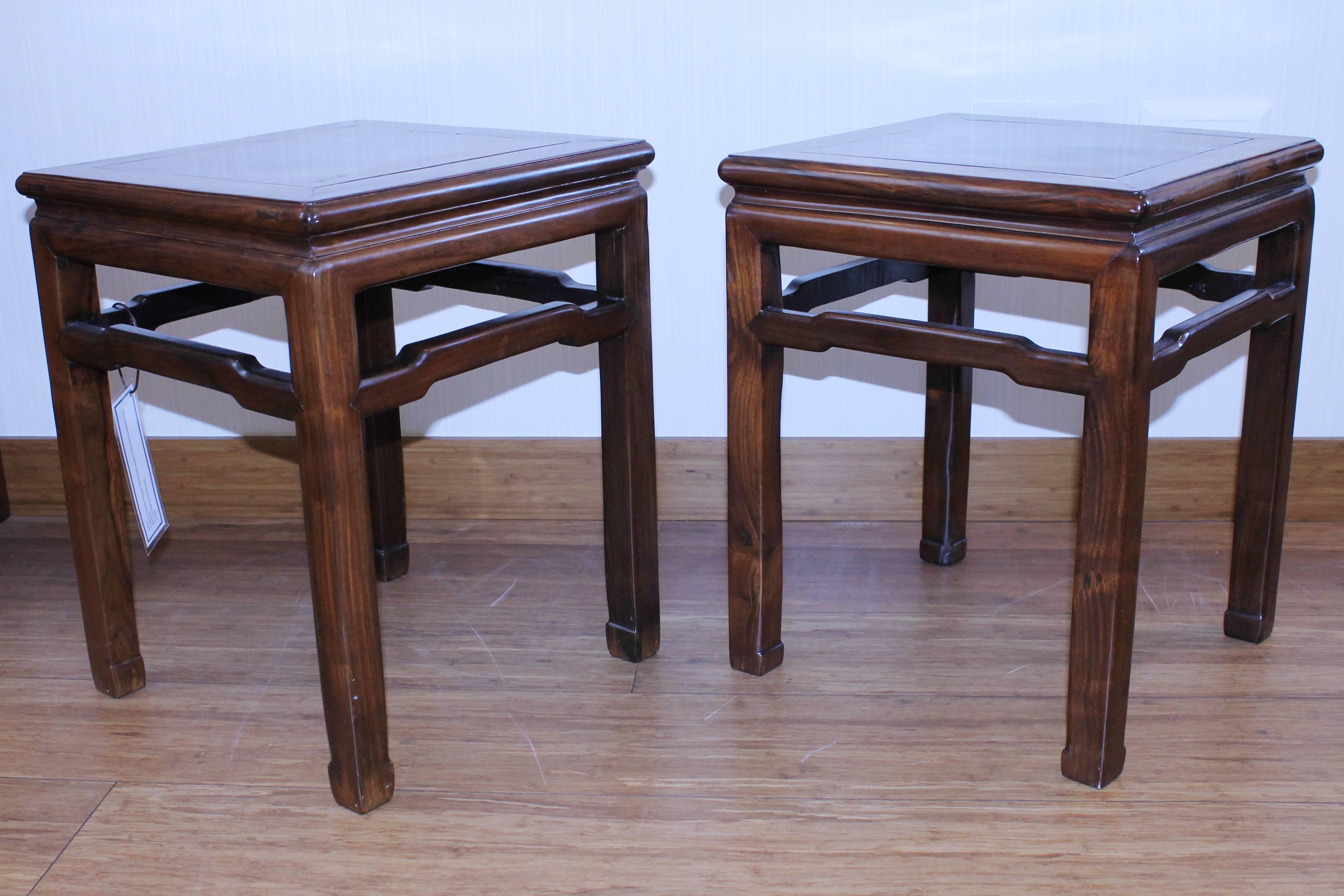 A pair of Chinese Hongmu (blackwood) square stools with humpback cross stretchers.

Measures: 40.5cm wide by 50.2cm high.

19th century.