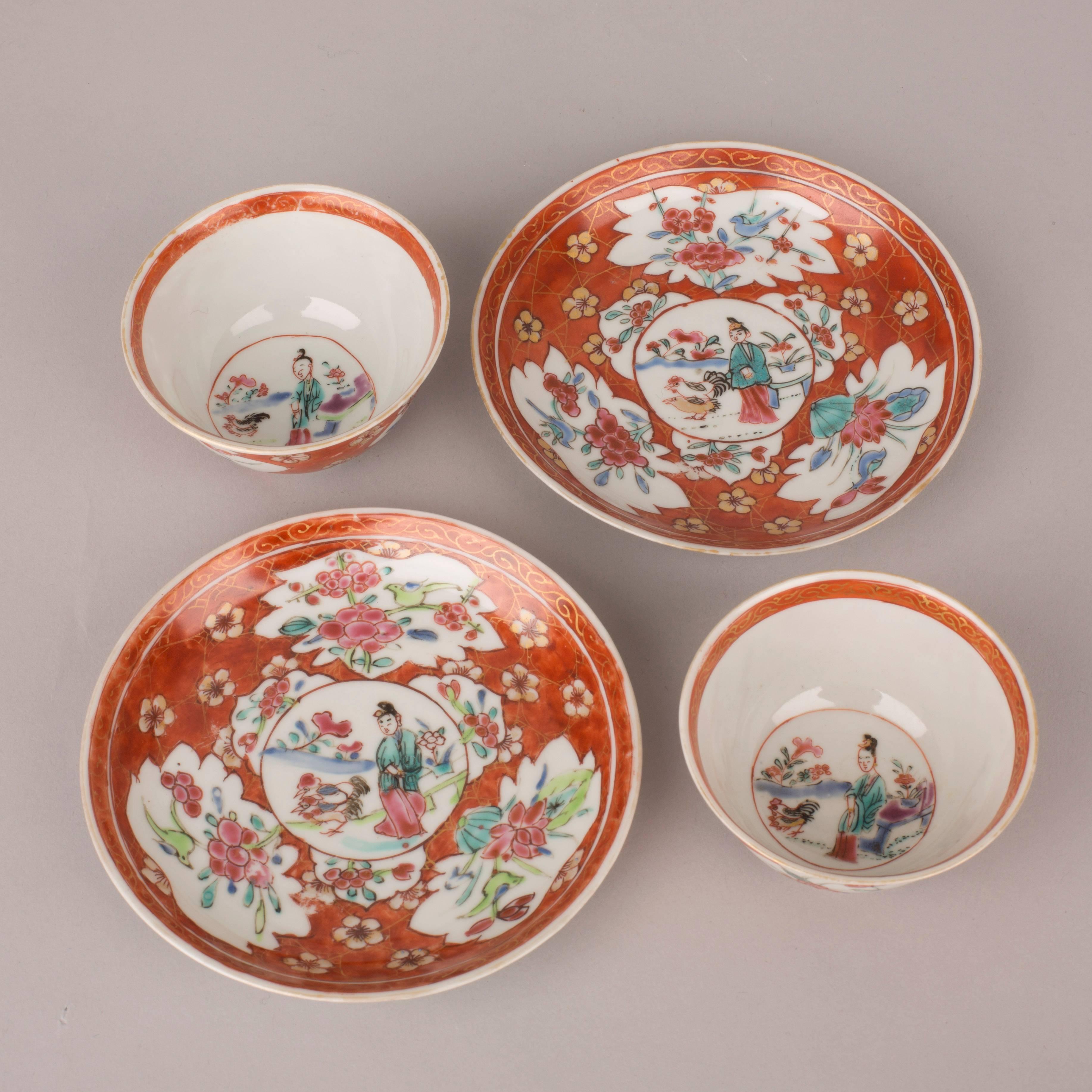 Pair of Chinese porcelain famille rose cups and saucers. The saucer painted with a central medallion of a lady with two chickens beside a flowering plant. River and flowers in the distance. Medallion surrounded by copper red and gilt cracked ice