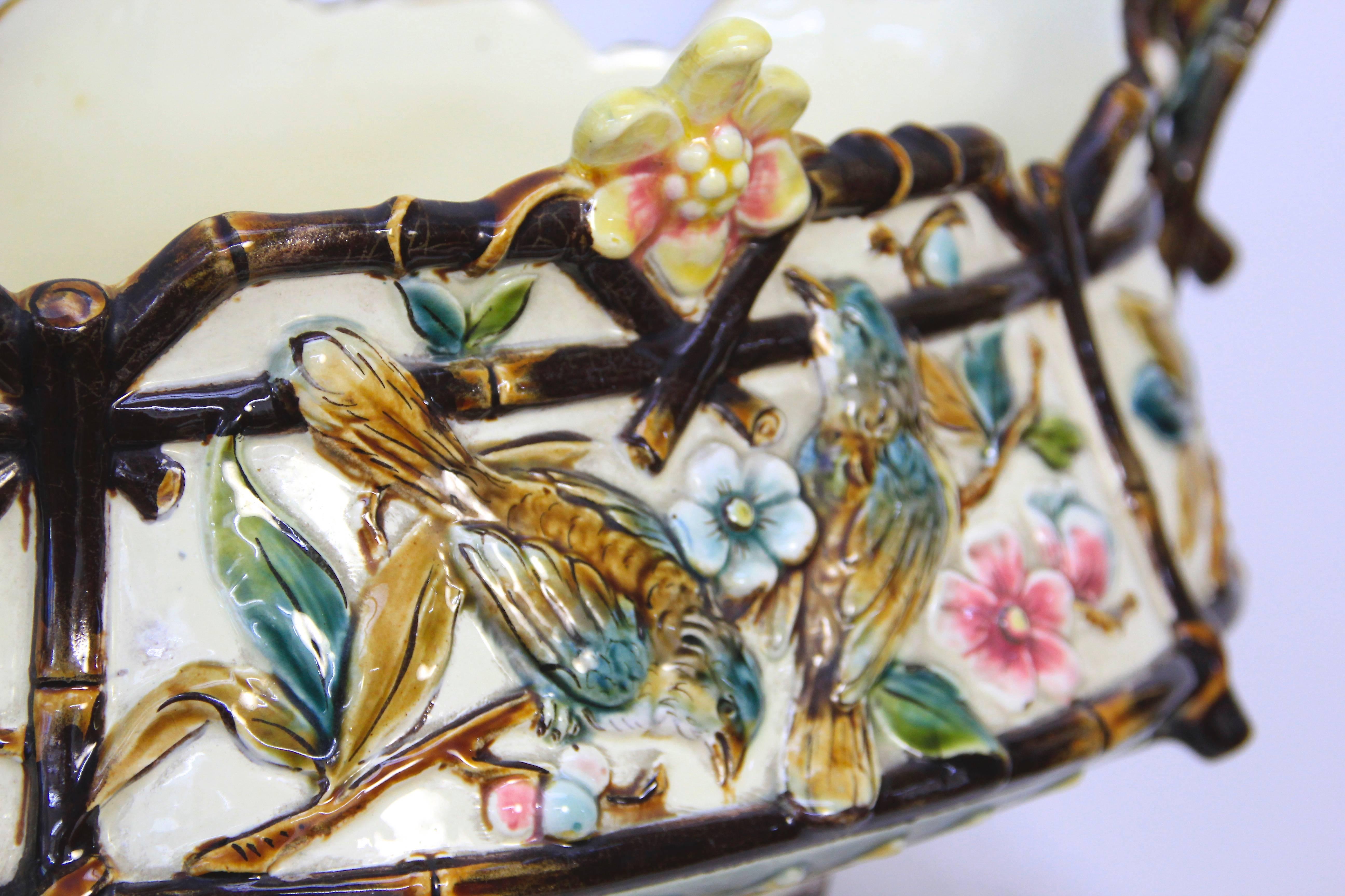 Richly decorated ceramic jardiniere made by the workshops of Znaimo, Czech Republic from, circa 1900. Lavishly decorated with hand-painted organic and floral design, this decorative jardiniere is hallmarked with the "flower hallmark" and