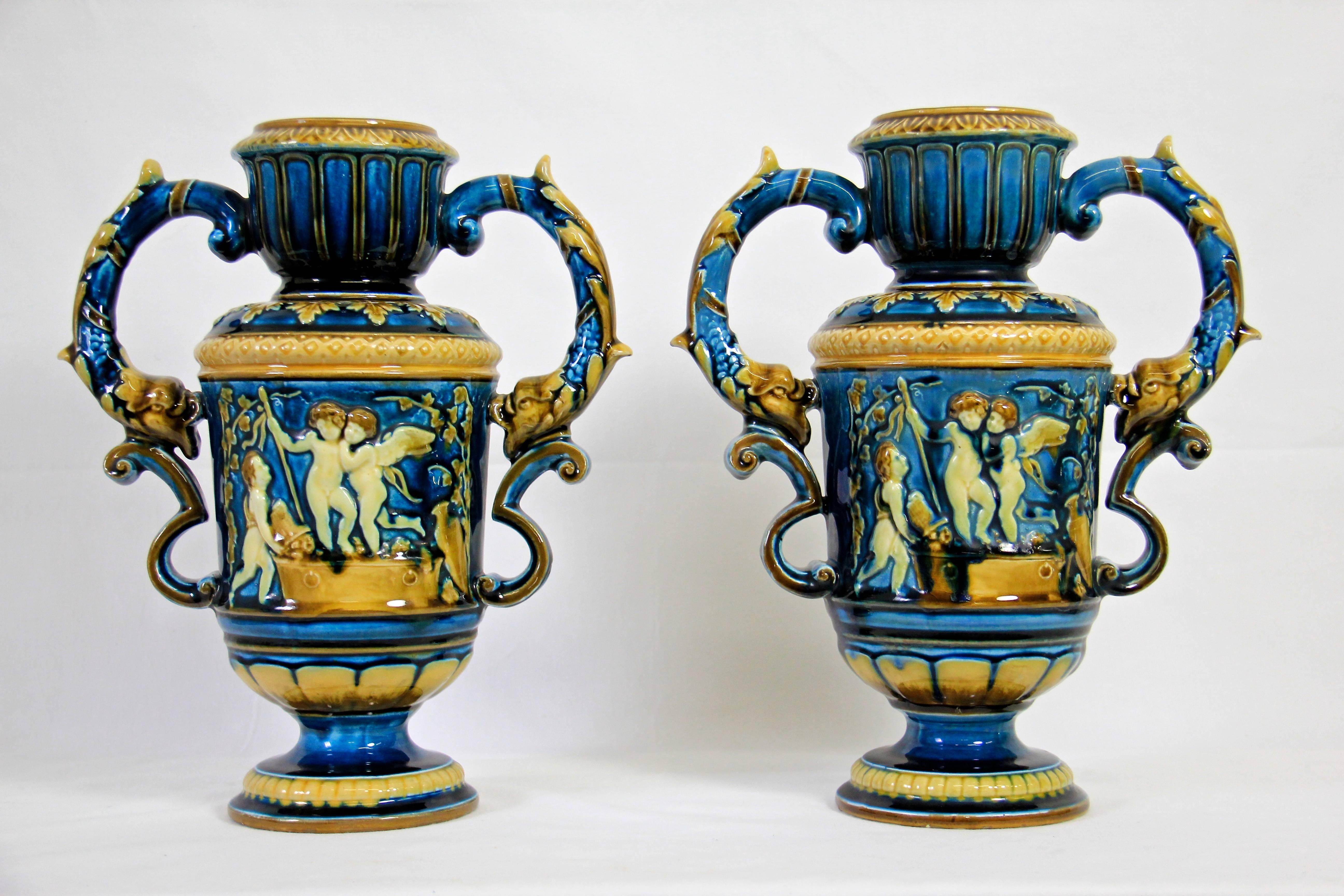 This amazing pair of Art Nouveau vases was made by the famous manufacture Schultz Oloumuszan Blansko. 
In 1854, the austrian producer Karl Schütz (1789-1872) acquired 1849 built earthenware factory, built by Peter Selb in Olomuszan Blanska in
