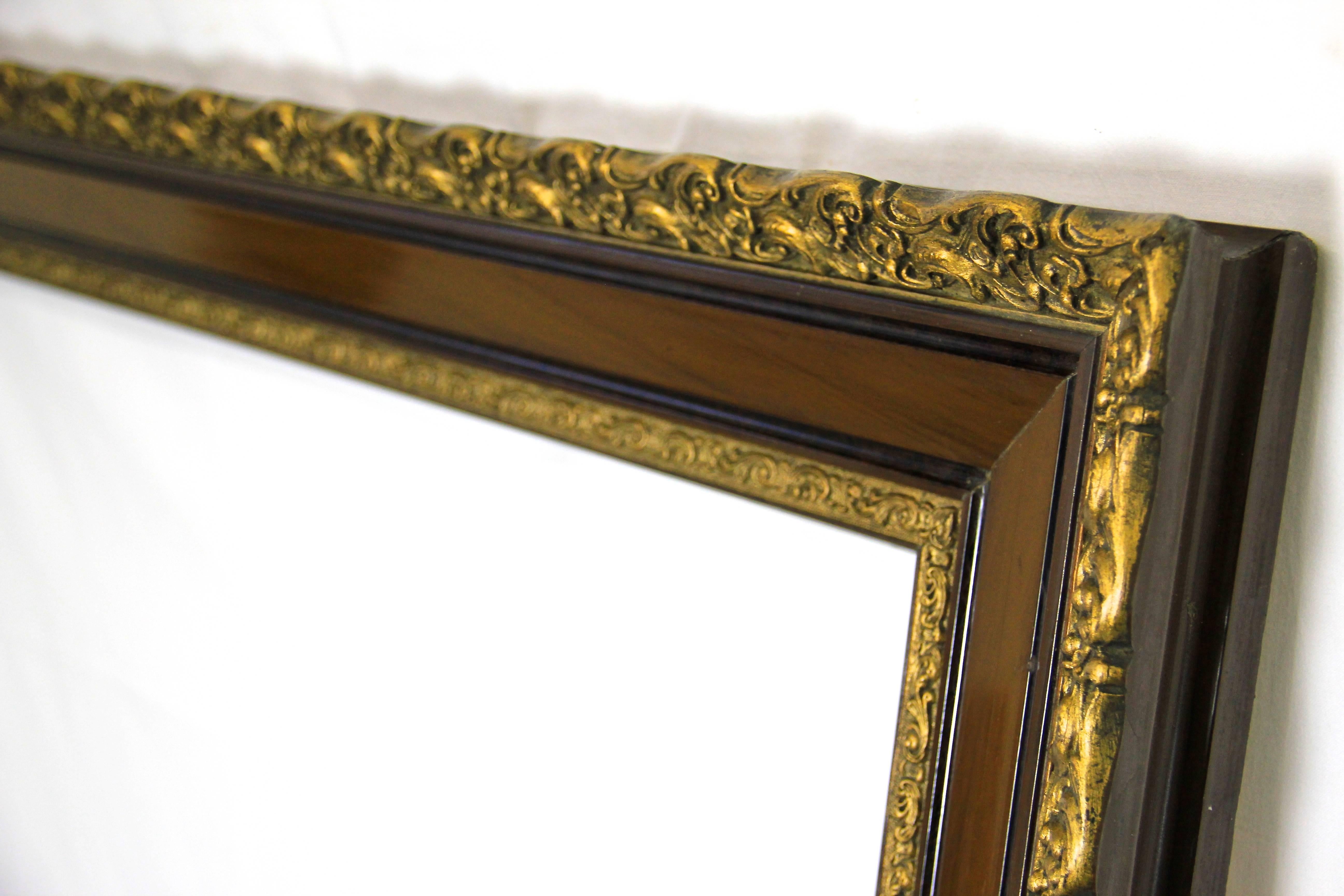 Beautiful large picture frame from the late 19th century in Austria. This frame shows a unique design with golden stucco pattern on the in- and outside. The centerpiece is trimmed to rosewood/nut and got a nice classical shellac finish.
An amazing