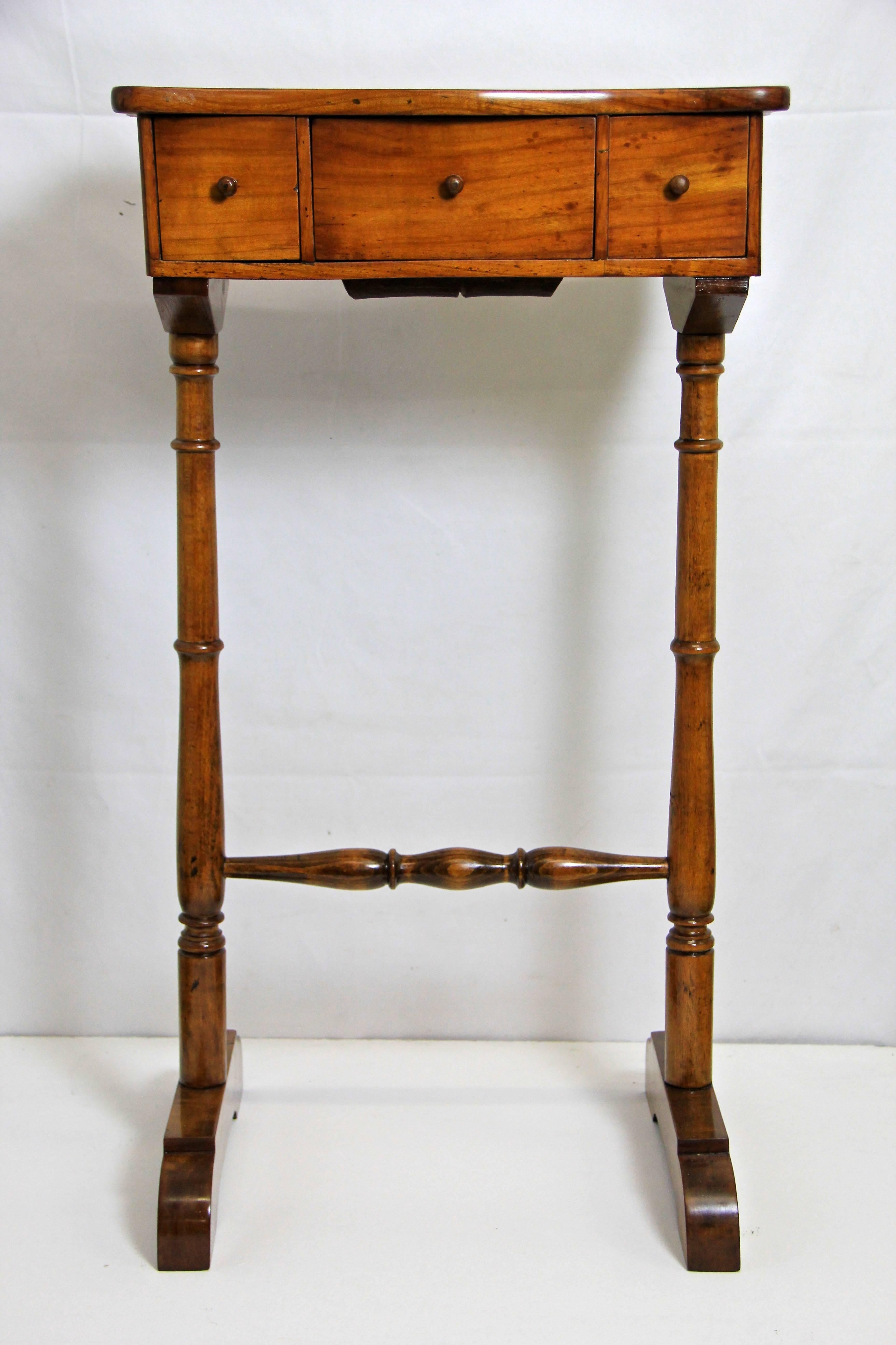 We present to you this absolute lovely Biedermeier sewing side table coming from the Austrian Biedermeier era around 1850. After 166 years this small table is still an eye-catcher. With two small drawers and a bigger center drawer this side table