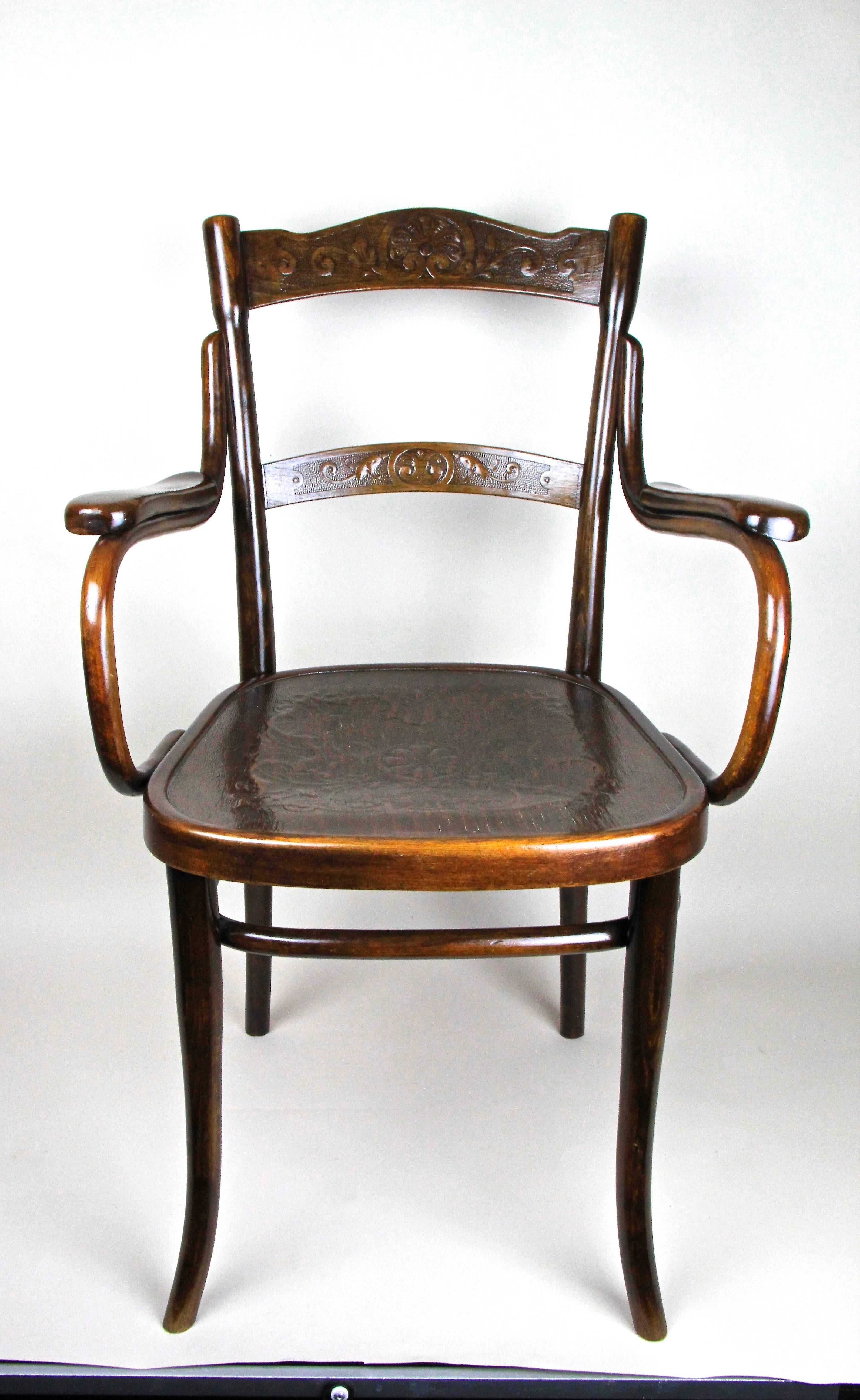 From the famous manufacture of Thonet in Vienna comes this extravagant and rare armchair, made circa 1885 out of beechwood and trimmed to nut wood.
On the backrests and the seat you will find amazing embossed ornamental designs, truly a fantastic