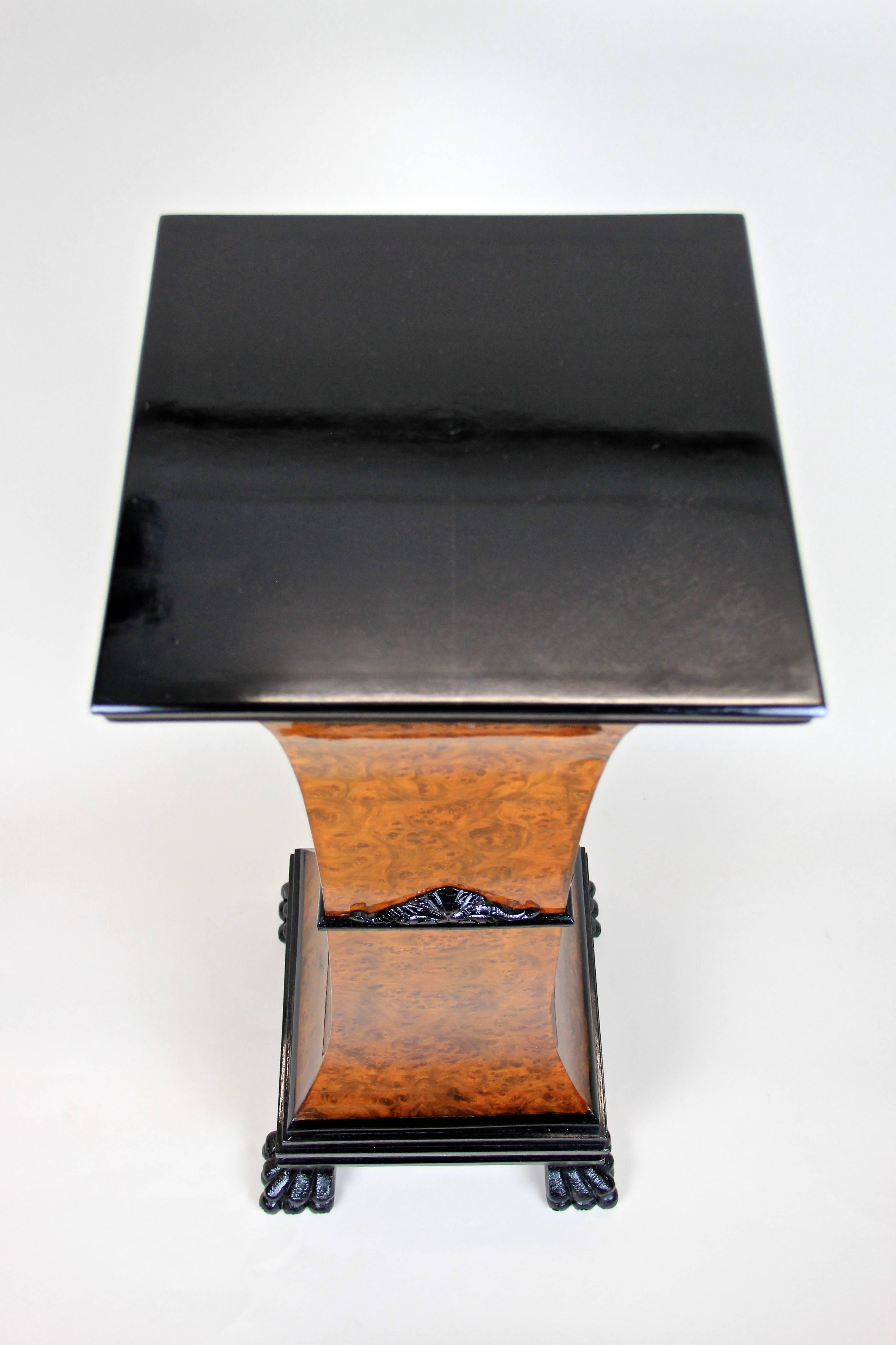 Very early Art Nouveau Pedestal from Austria, circa 1890. The amazing vase-shaped pedestal veneered in wonderful bird's-eye maple stands on four ebonized hand-carved lion paws and shows an ebonized plate on top. Four dainty hand-carved ebonized