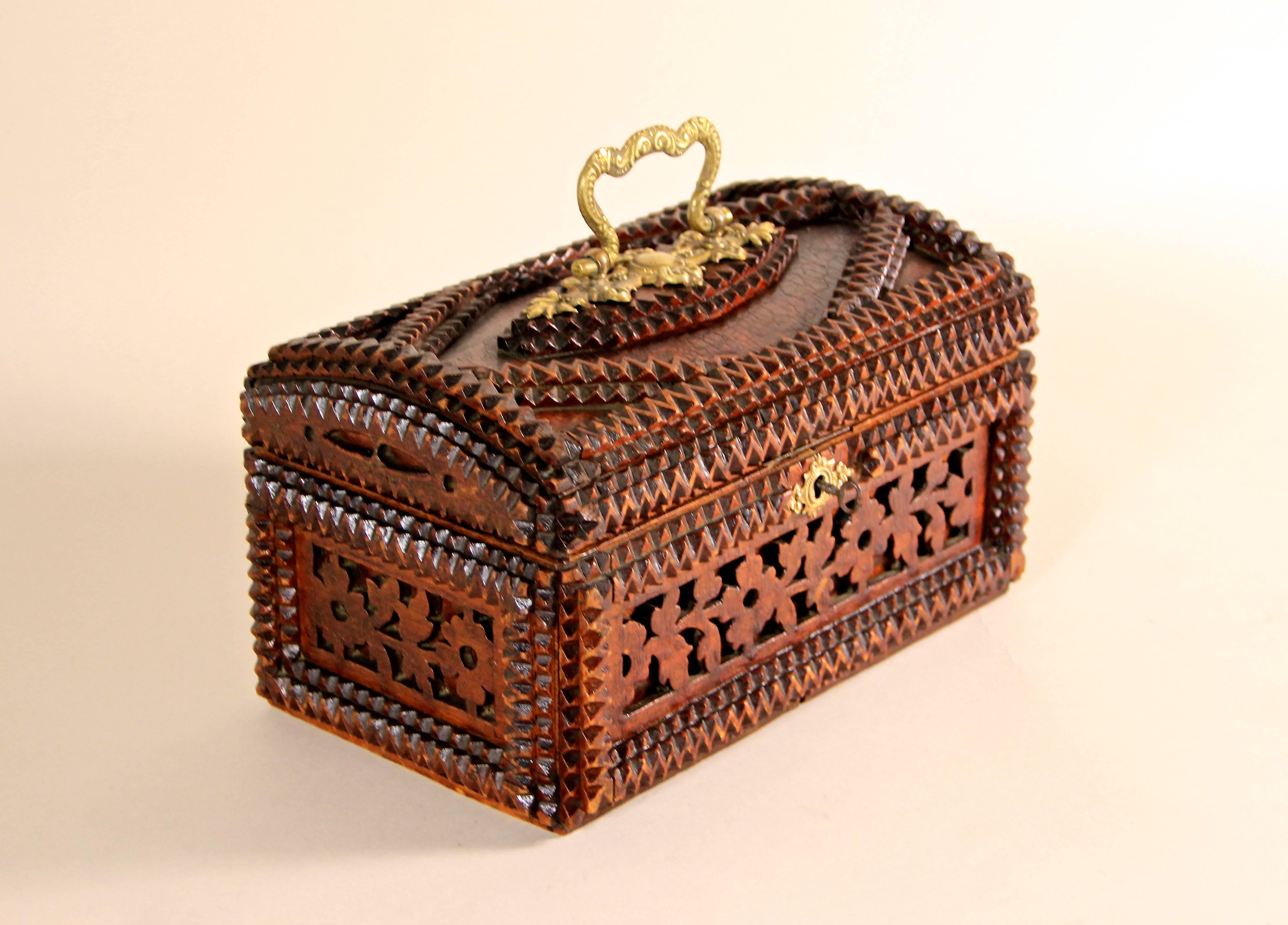 Another fine box in our collection is this exceptional Tramp Art Box from the late 19th century, the so called historism era. Made out of many single hand-carved pieces, this Tramp Art box offers an absolute unique design with flower carvings
