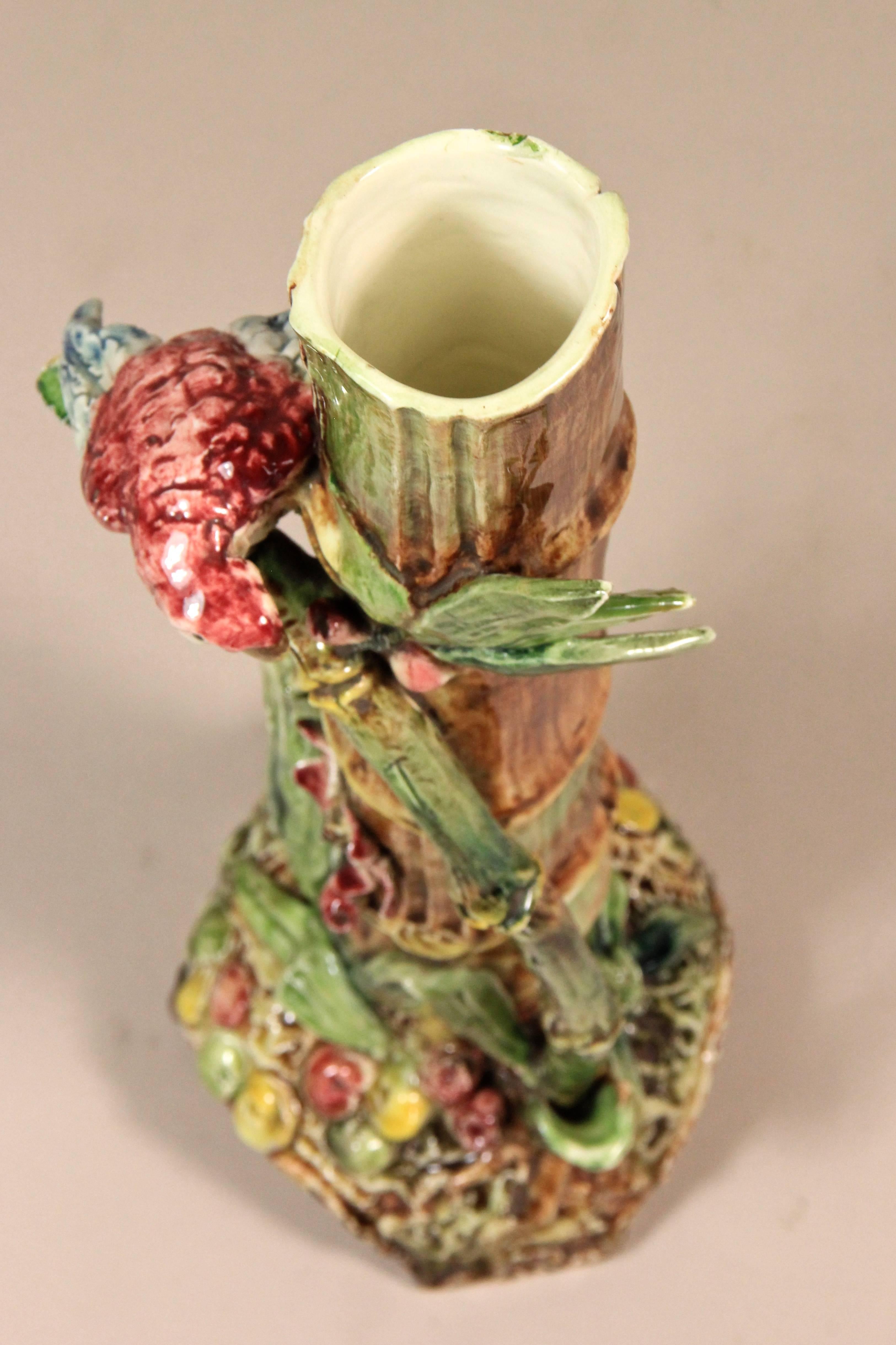 Unusual Art Nouveau Vase attributed to the workshops of Znaimo from circa 1900. This absolute gorgeous piece of majolica shows a super fancy design - just have a look at the bamboo and the parrot, handpainted in great color tones for 100% caribbean