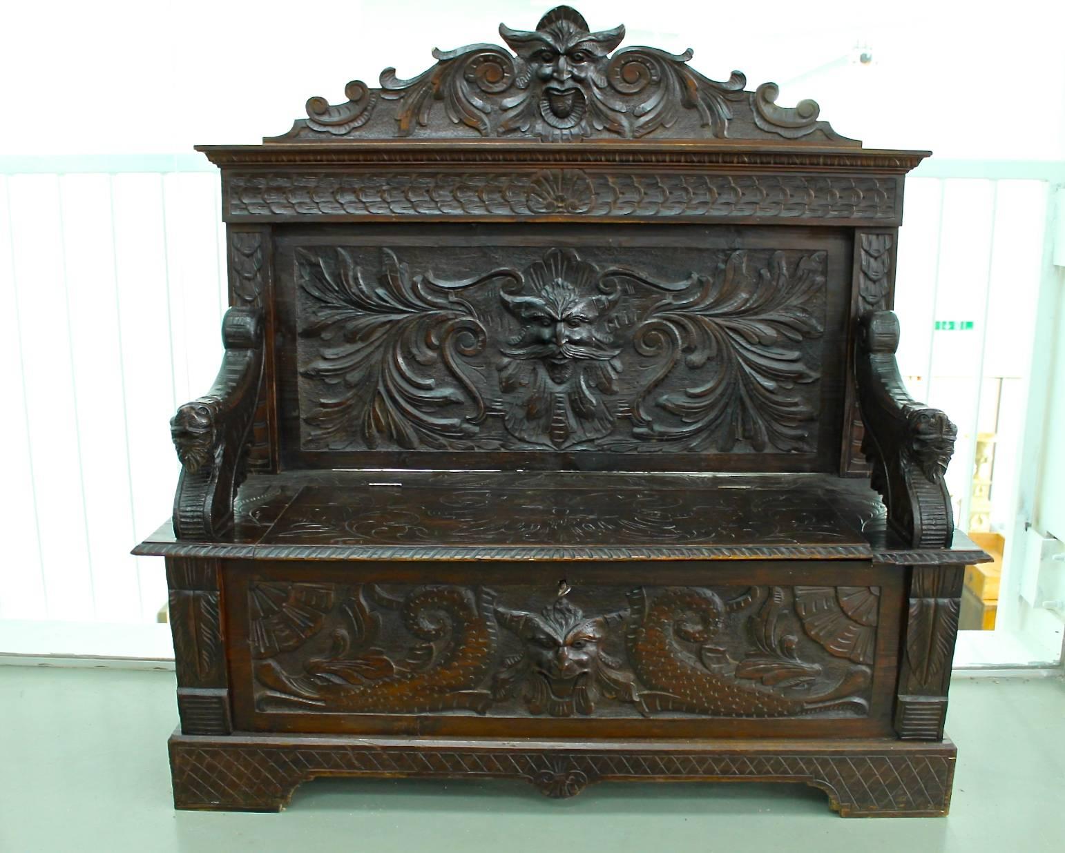 Have a look at this exceptional carved Baroque Revival chest bench from around 1880. This piece captivates through its elaborated carving works. Moreover it is very practically because of a hidden chest under the seating area - which is lockable!
 