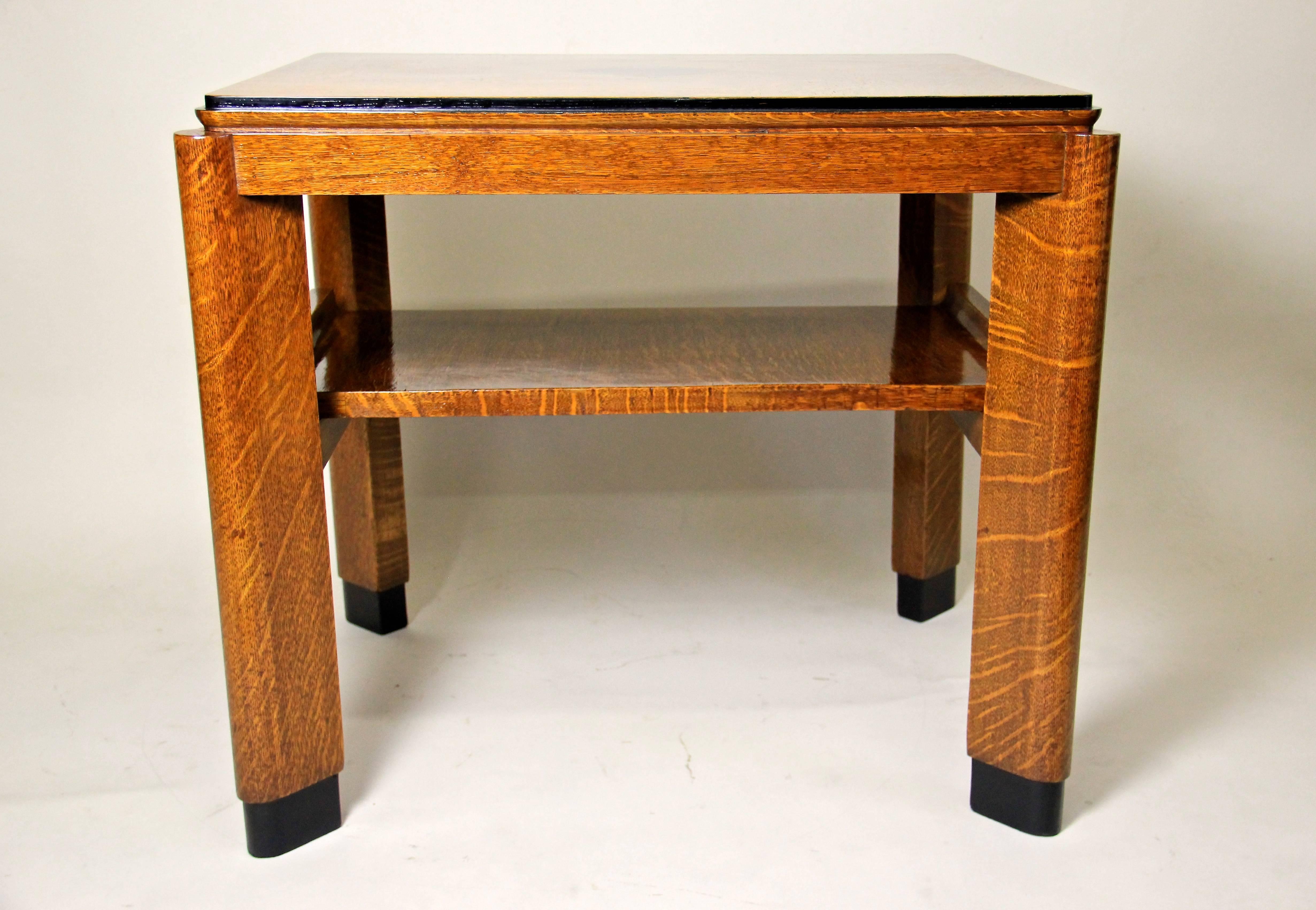 This outstanding Austrian Art Deco table was made of fine oakwood veneer in Austria around 1925. The absolute amazing design of this beautiful piece is worthy of note, just watch the nice tray underneath the tabletop!
The wonderful oak veneer