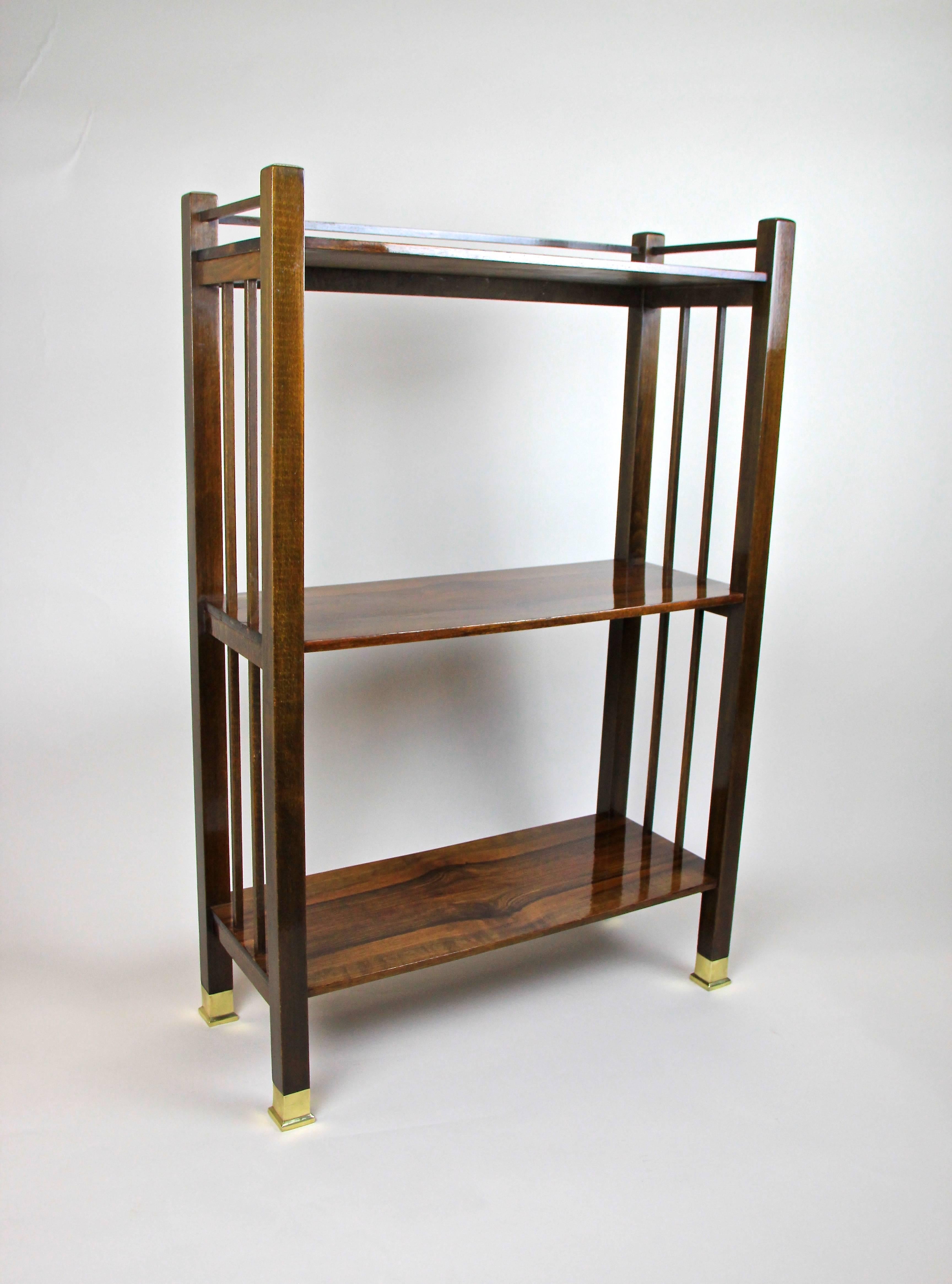 With more then 110 years of age this beautiful Art Nouveau etagere is coming from Vienna/ Austria. Made out of beech and trimmed to nut wood, this gorgeous etagere contains three shelves beautifully veneered in fine bookmatched nut wood. The clear